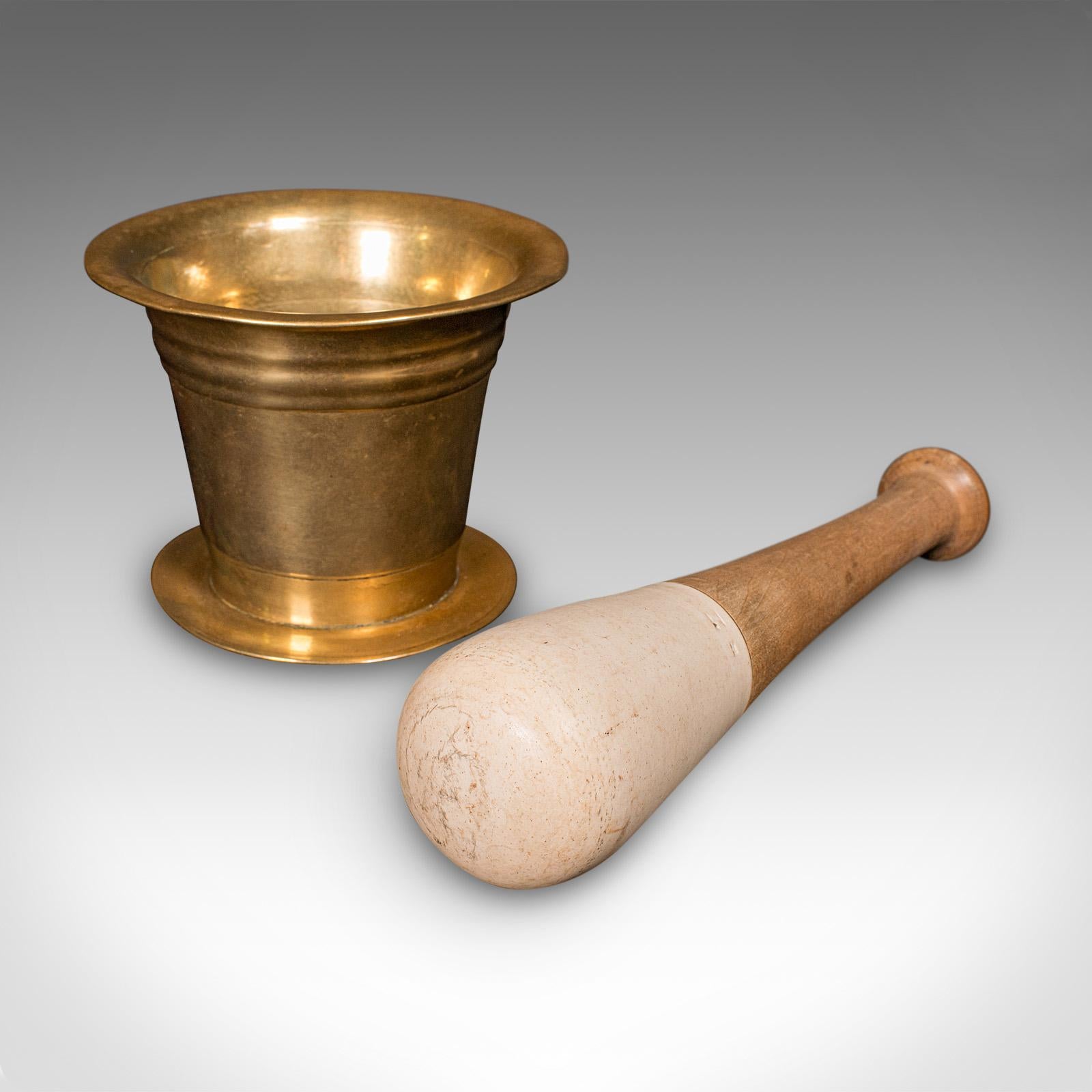 
This is an antique apothecary mortar and pestle. An English, bronze and beech chemist's aid, dating to the Victorian period and later, circa 1890.

Graced with a bright appearance and wonderfully tactile
Displays a desirable aged patina and in good