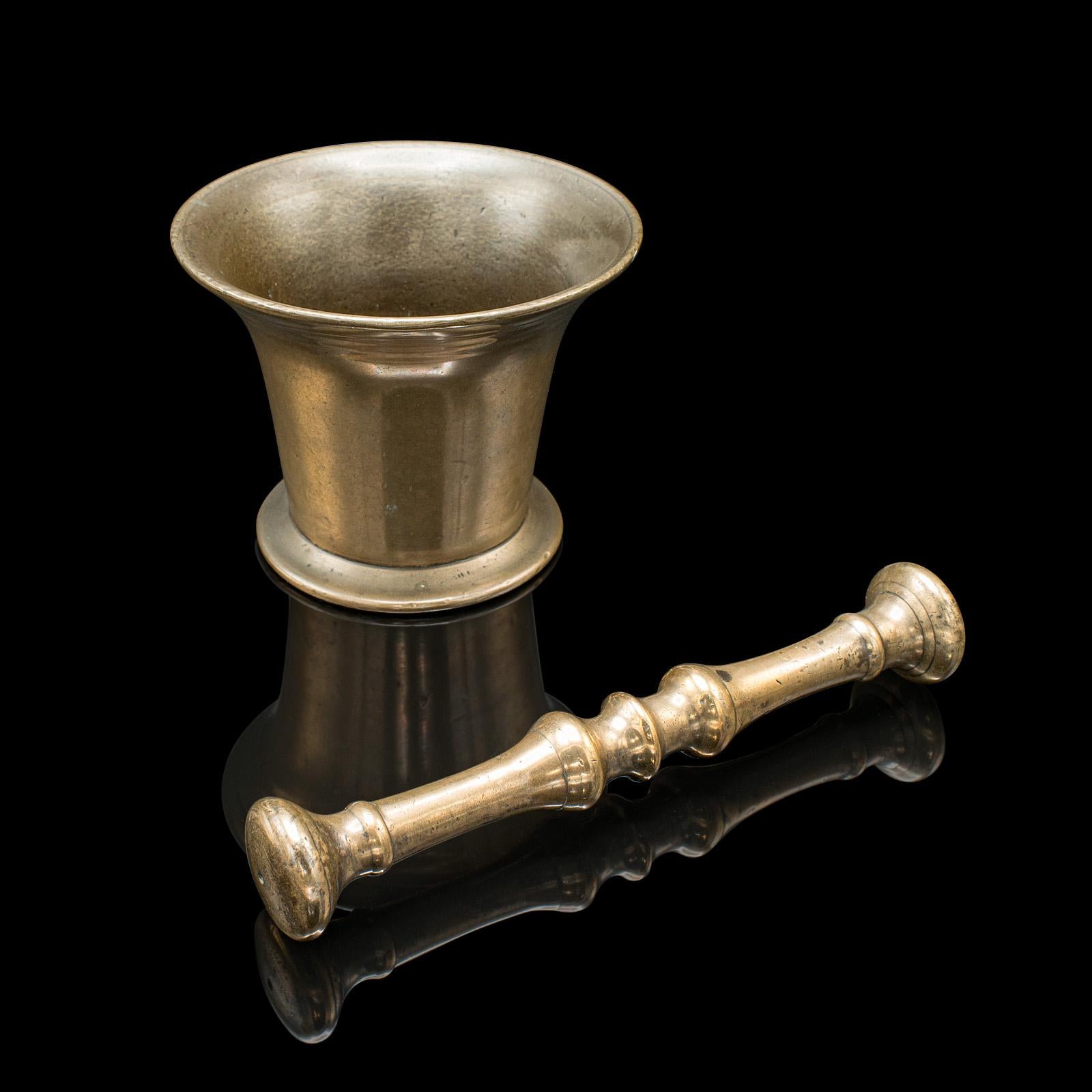 
This is an antique apothecary mortar and pestle. An English, bronze chemist's shop aid, dating to the Georgian period, circa 1800.

Quality Georgian apothecary aid with superb finish and weight
Displays a desirable aged patina with light signs of