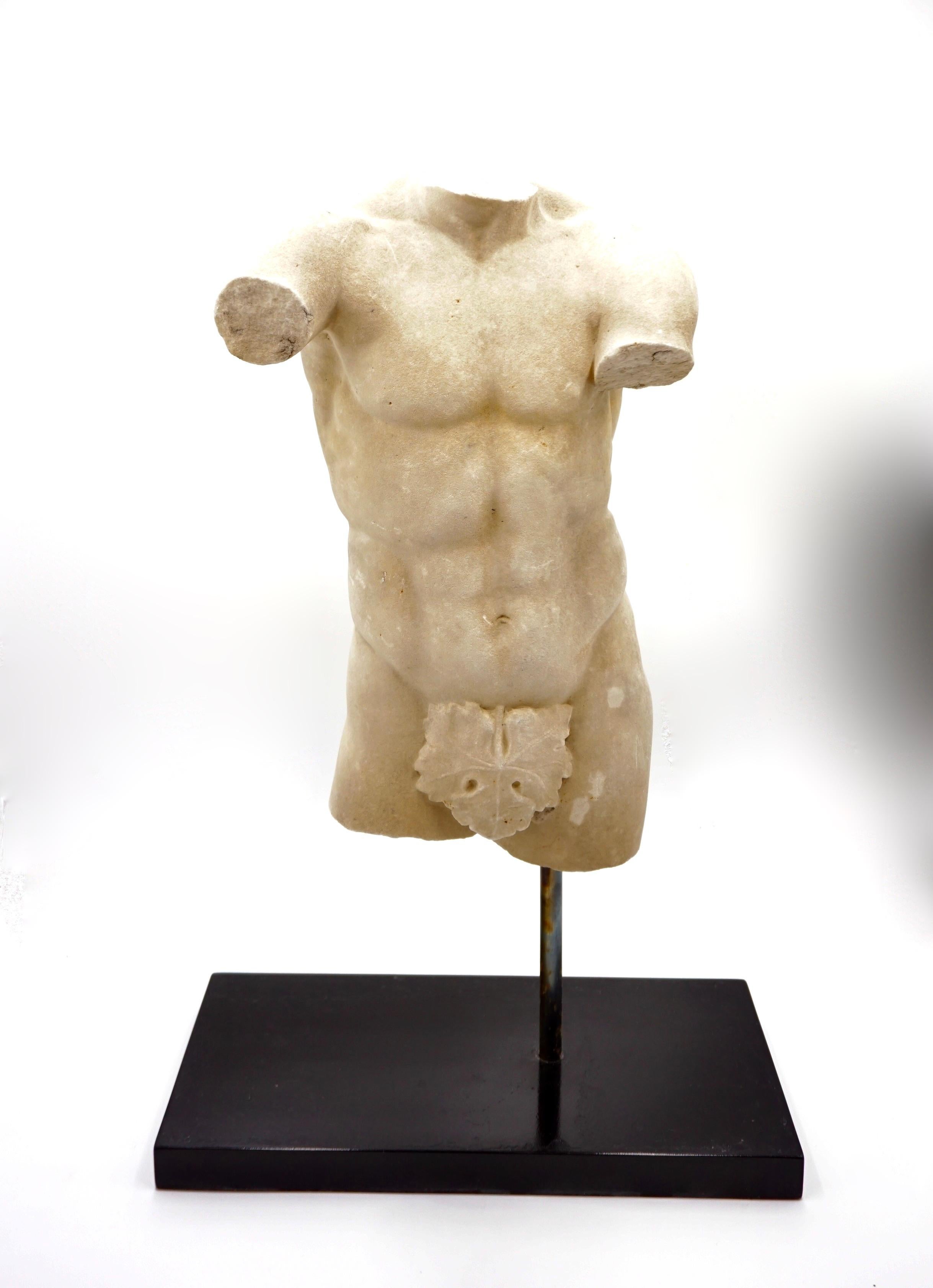 Antique male marble torso, circa 1850
A copy of the roman marble statue Apoxyomenus in Musei Vaticani in Rome (I sec d.c.) copy of a greek bronze athlete statue Apoxyomenos masterpiece of Lisippo about 320 a.c. 
As is typical of Lisippo's works,