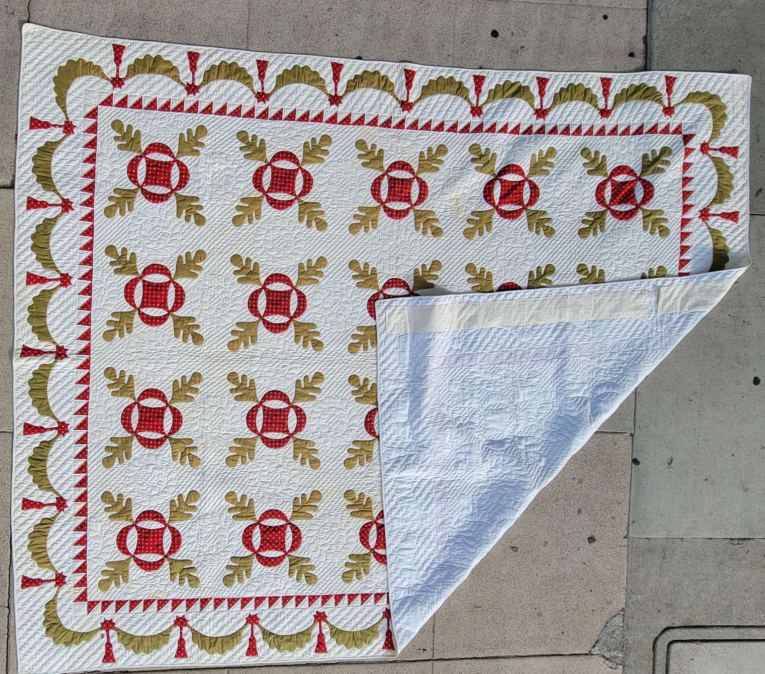 This amazing autumn leaf applique quilt is in pristine condition and has a very unusual swag border. It comes to us from Southern Ohio from the family -mother that made the quilt. This quilt is from the early 20thc and was quilted years later.