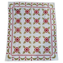 Quilt antique en appliques avec bordure en forme de guirlande