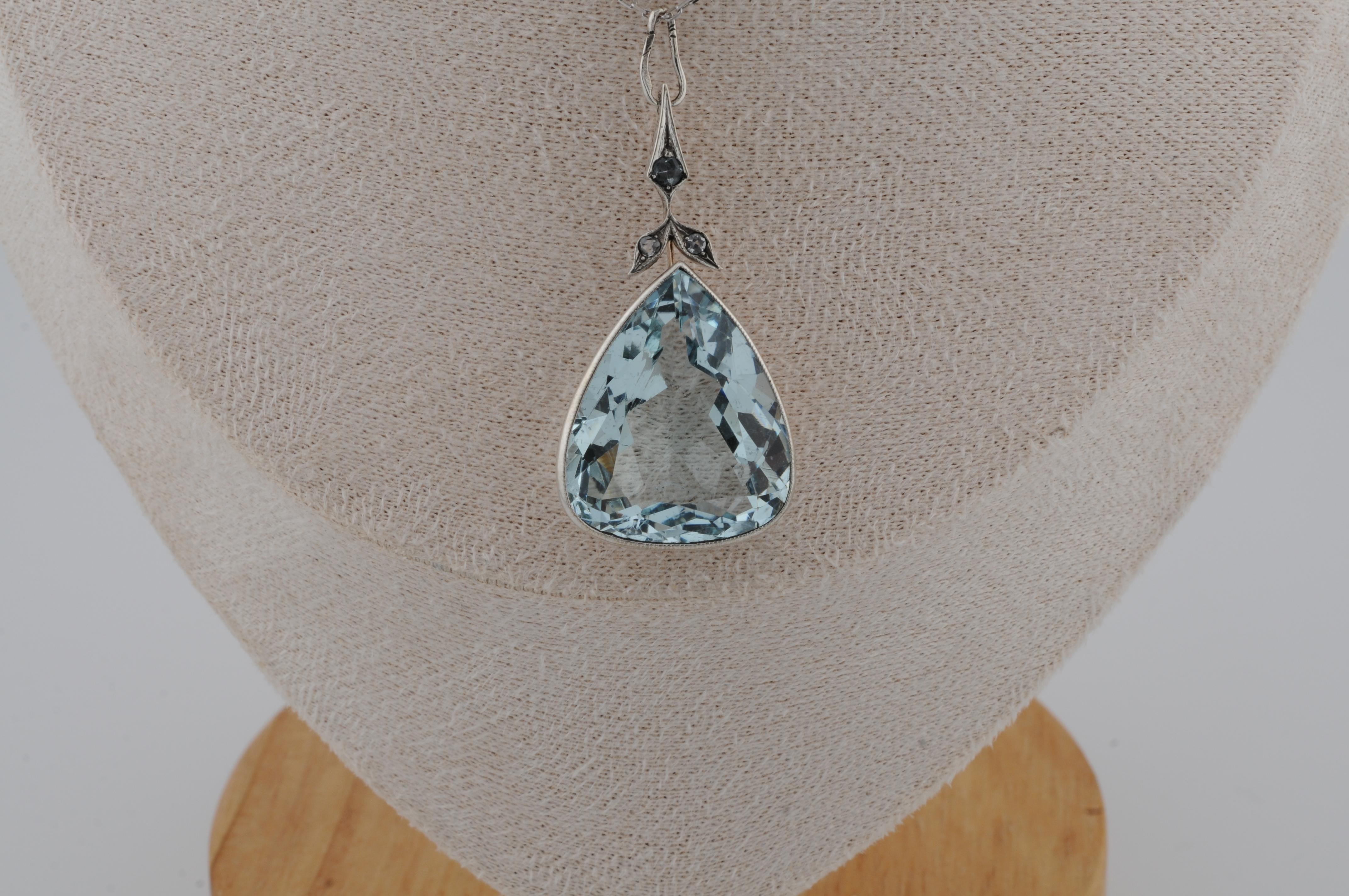 Pendant with Aquamarine in pear cut White and Rose Gold

Pendant handcrafted in 14K white and rose gold. Set at the center is a faceted aquamarine weighing approximately 25 ct, held in a bezel setting with an open back.