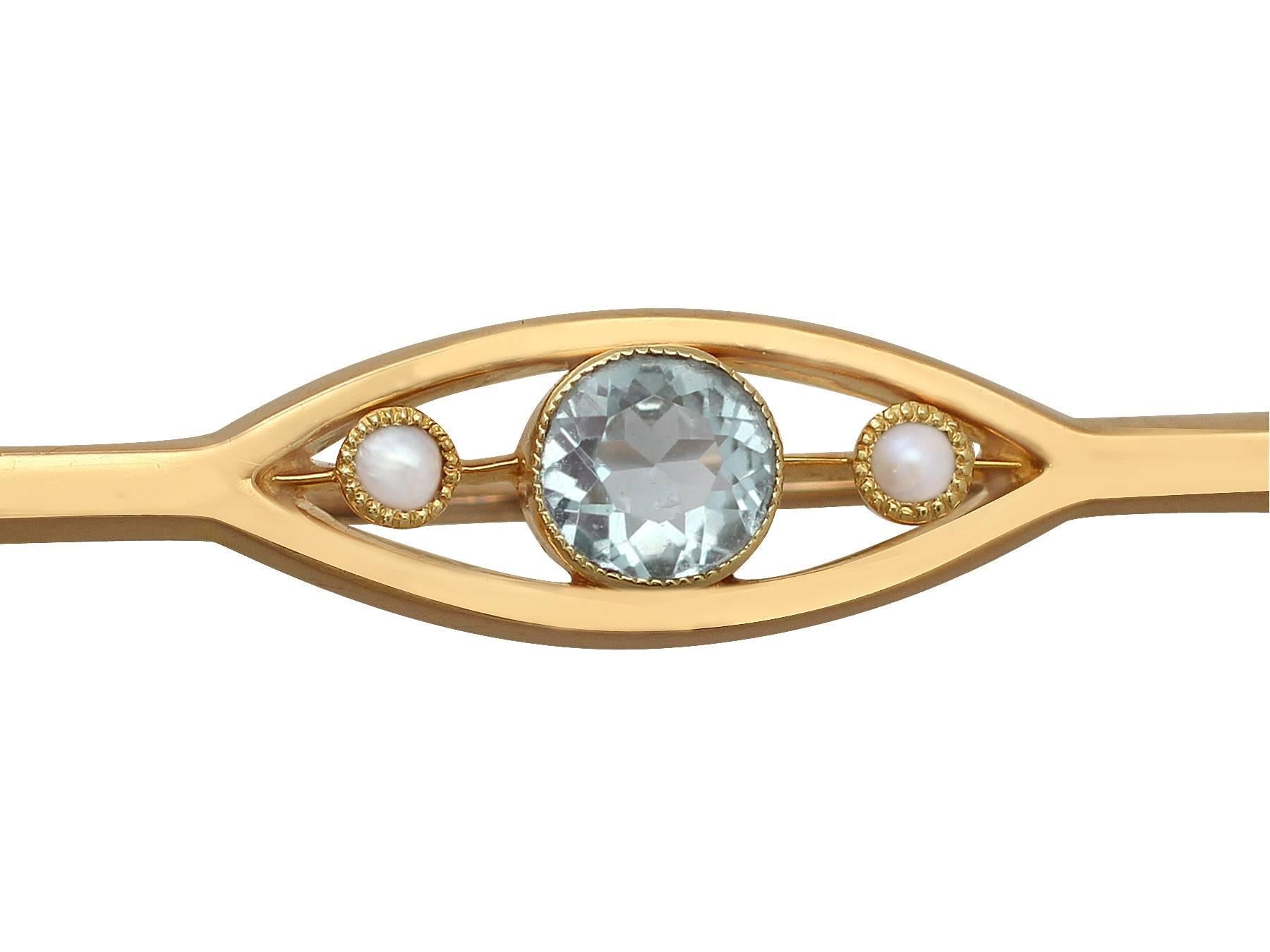 A fine and impressive antique 0.47 carat natural aquamarine and seed pearl, 15 karat yellow gold brooch; part of our gemstone brooch collection

This fine antique aquamarine brooch has been crafted in 15k yellow gold.

The bar brooch features a