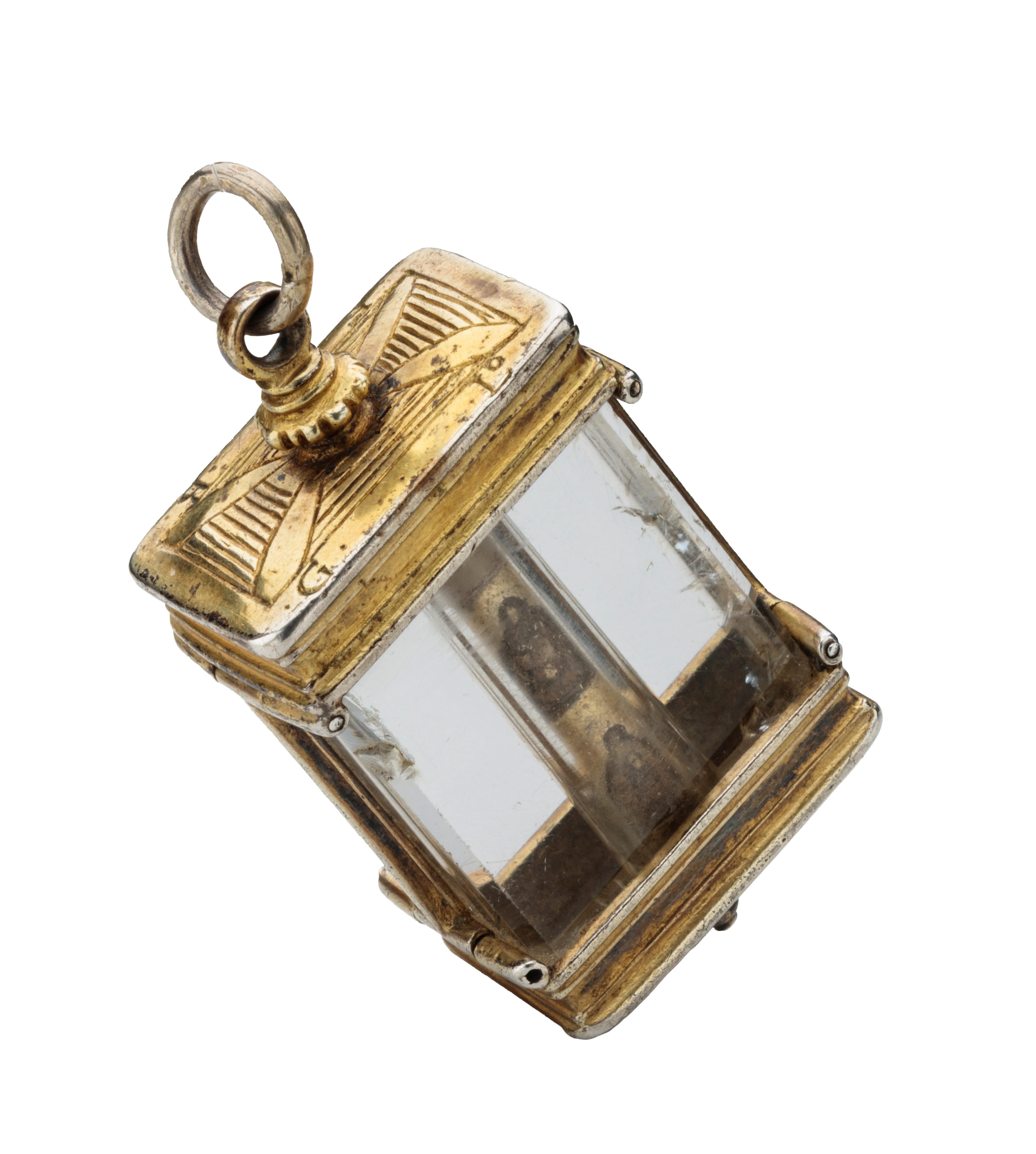 ROCK CRYSTAL PENDANT WITH COLUMN
France or Italy, 16th century 
Fire-gilded silver, rock crystal, verre églomisé  
Weight 96 grams; dimensions 75 × 35 × 21 mm (with loop)  

Architectural pendant with rectangular cross section, rock crystal casing,