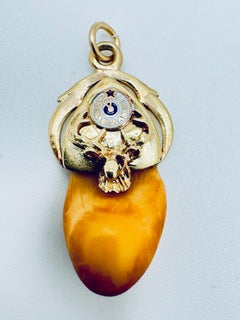 Antique Arcon-Shaped Elk Head Tooth Pendant with Ruby Eyes