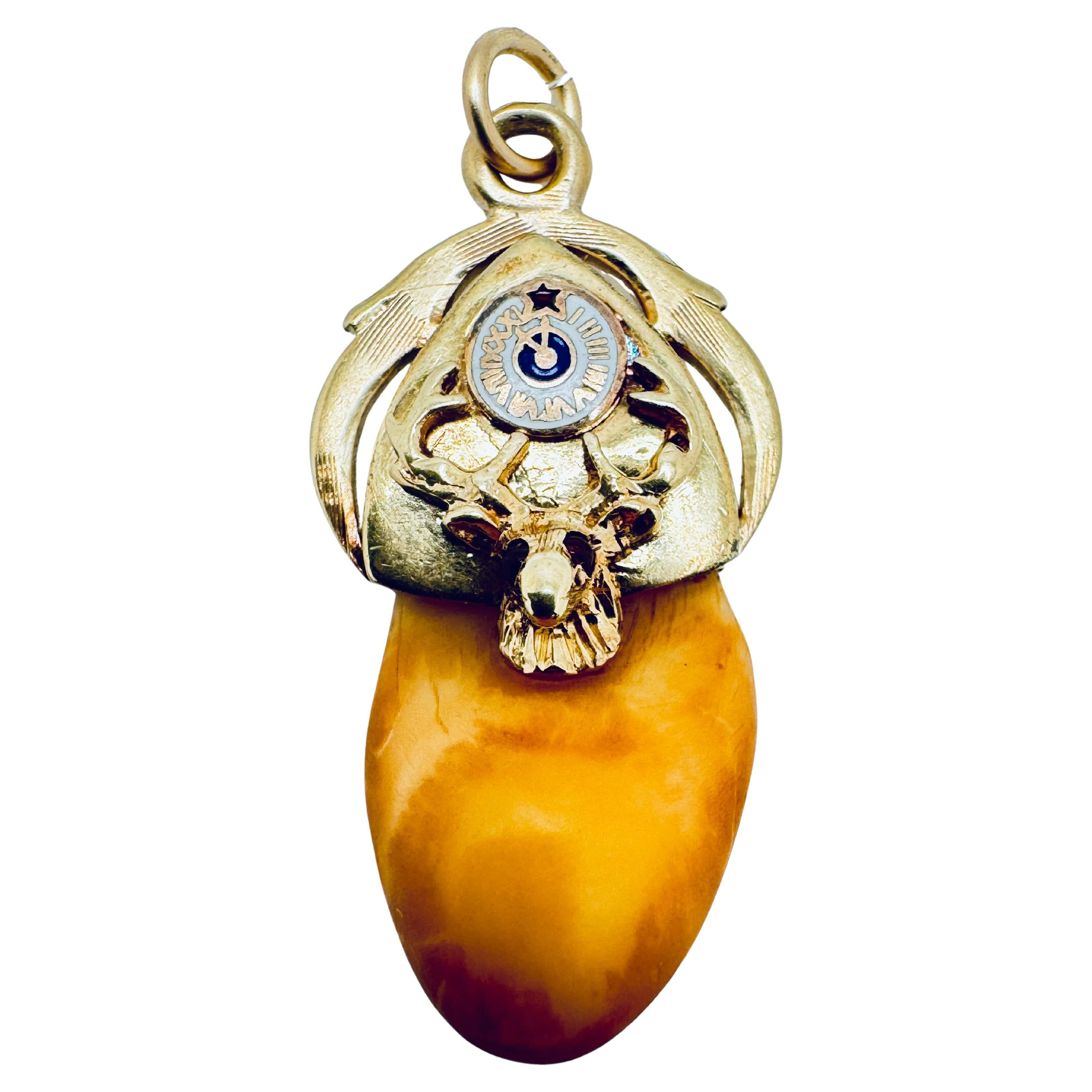 Antique Arcon-Shaped Elk Head Tooth Pendant with Ruby Eyes For Sale