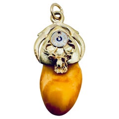 Antique Arcon-Shaped Elk Head Tooth Pendant with Ruby Eyes