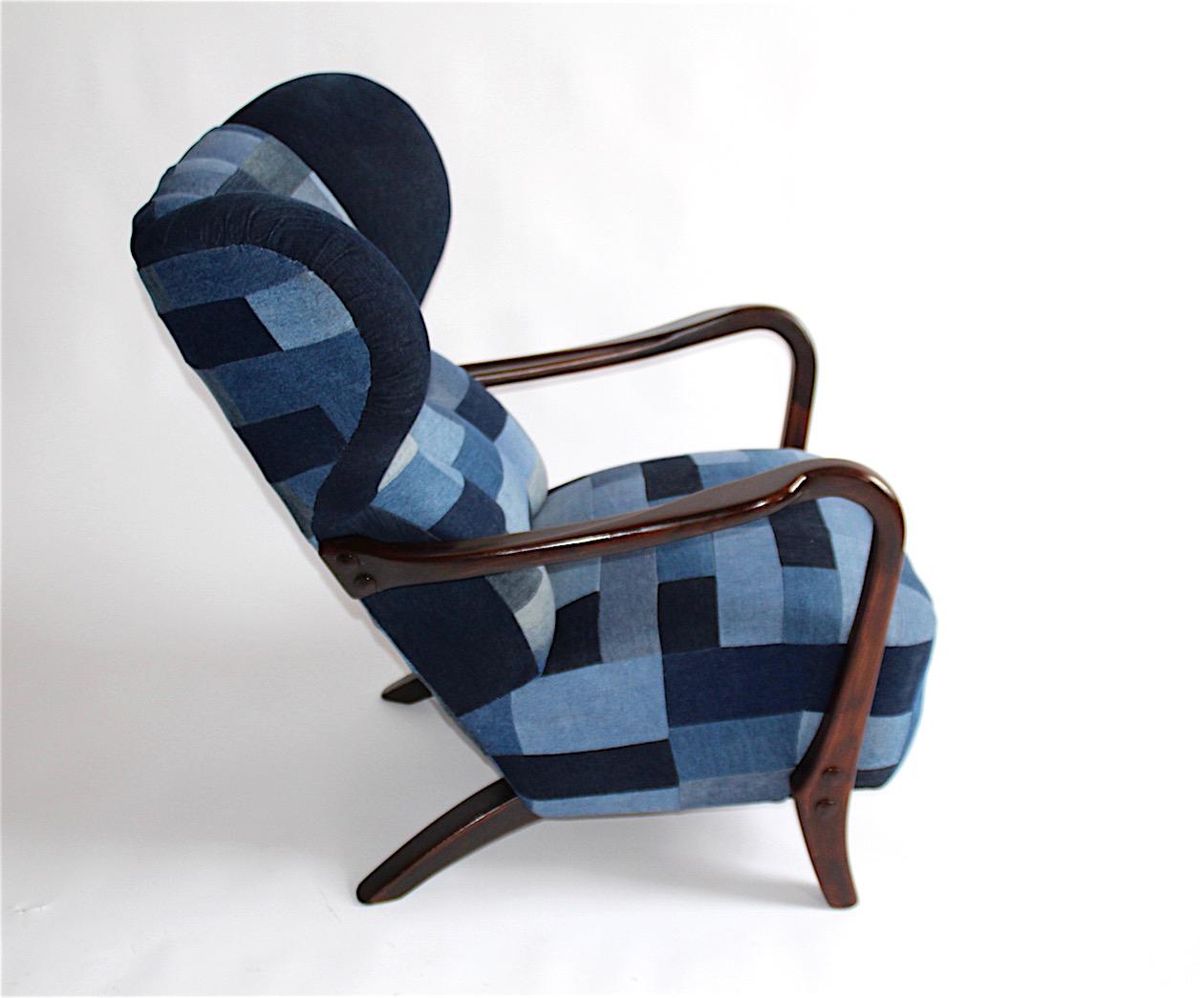 The chair is completely renovated, the wood is sanded, painted, the interiors of the seat and the backrest all replaced and upholstery sewn from pieces of denim.