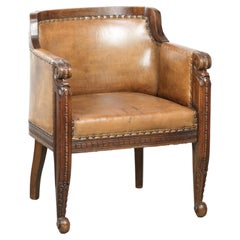 Antique armchair made of sheepskin and wood with decorative nails