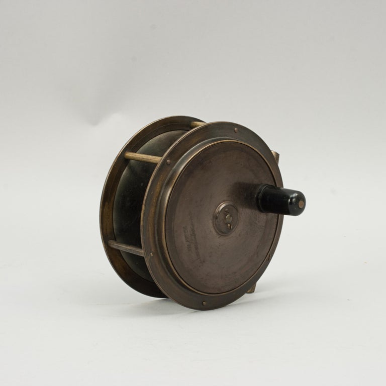 Army and Navy Brass Salmon Fishing Reel.
A very good 4 ¾ inch brass salmon fishing reel by the Army & Navy Stores, London. The reel with raise housing, brass foot, smooth check and ebonised handle. The back plate engraved 'A&N C.S.L, Makers,