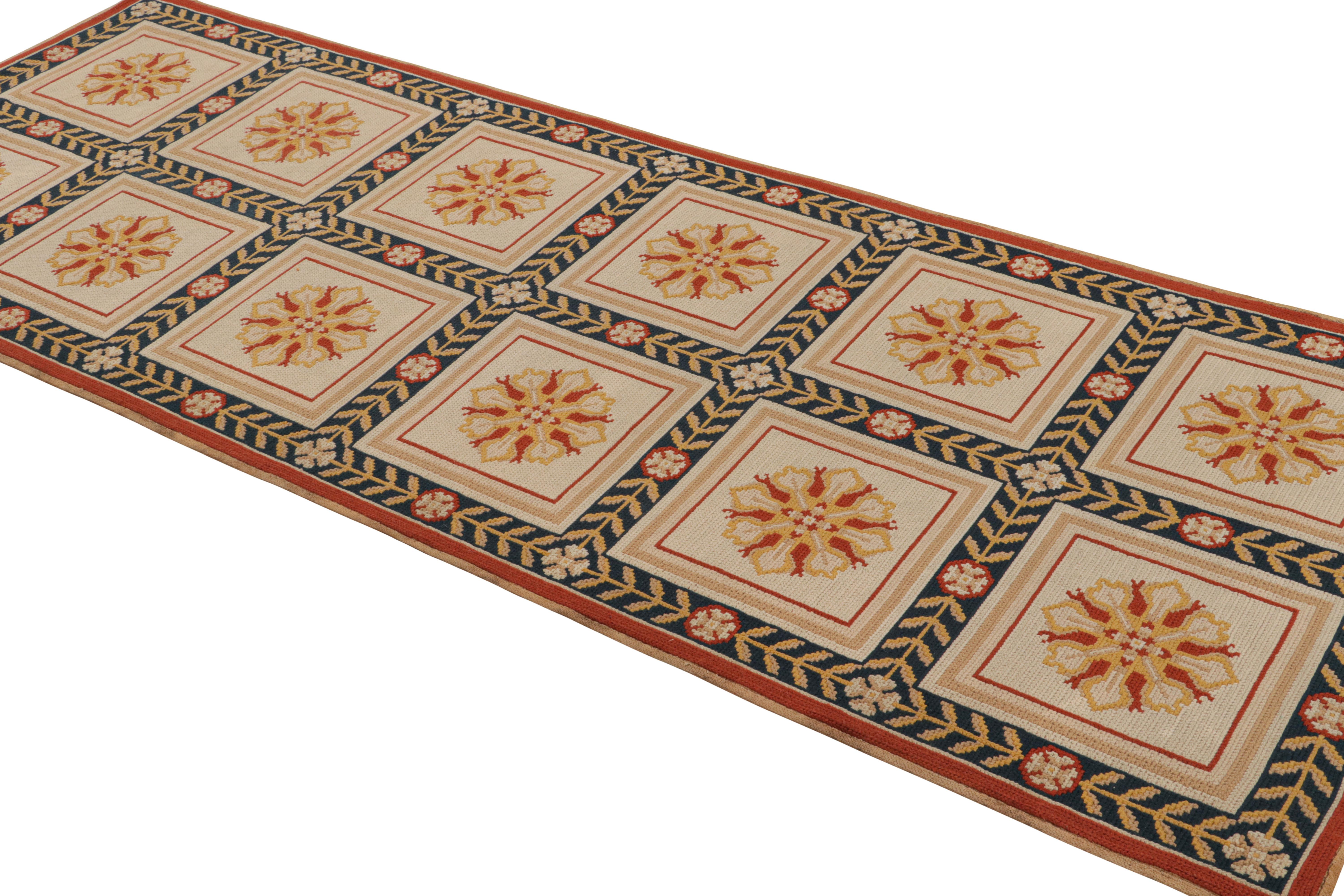 Handmade with wool, this 3×9 antique Arraiolos runner rug originates from Portugal circa 1920-1930, via the provenance of the same name—a particularly coveted tradition of needlepoints by women weavers of this nation known by admirers of the craft