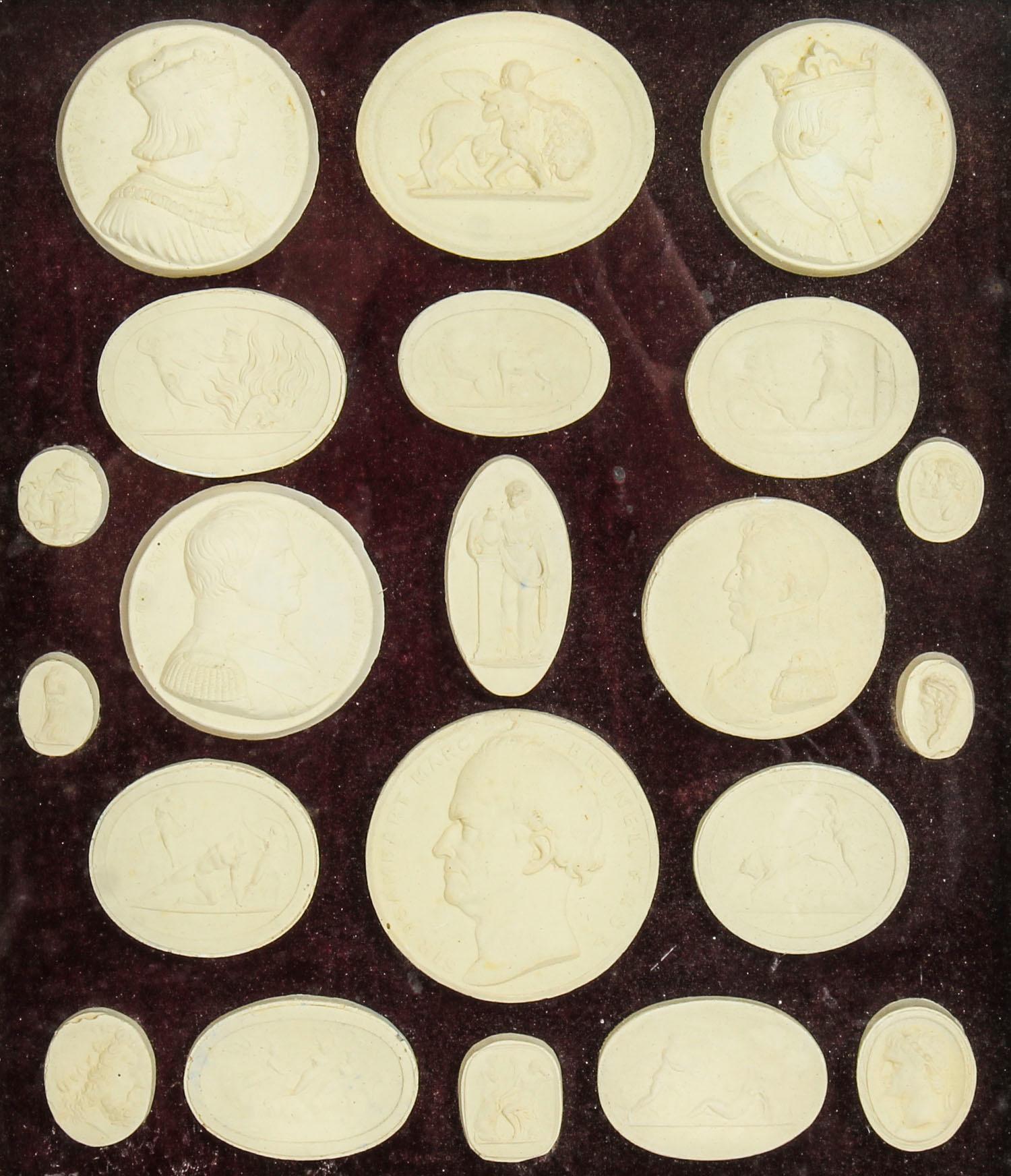 This is a truly magnificent decorative arrangement of twenty-one framed plaster intaglios of various antique subjects, circa 1840 in date.
 
These splendid intaglios are beautifully mounted on the original purple velvet ground and set in the