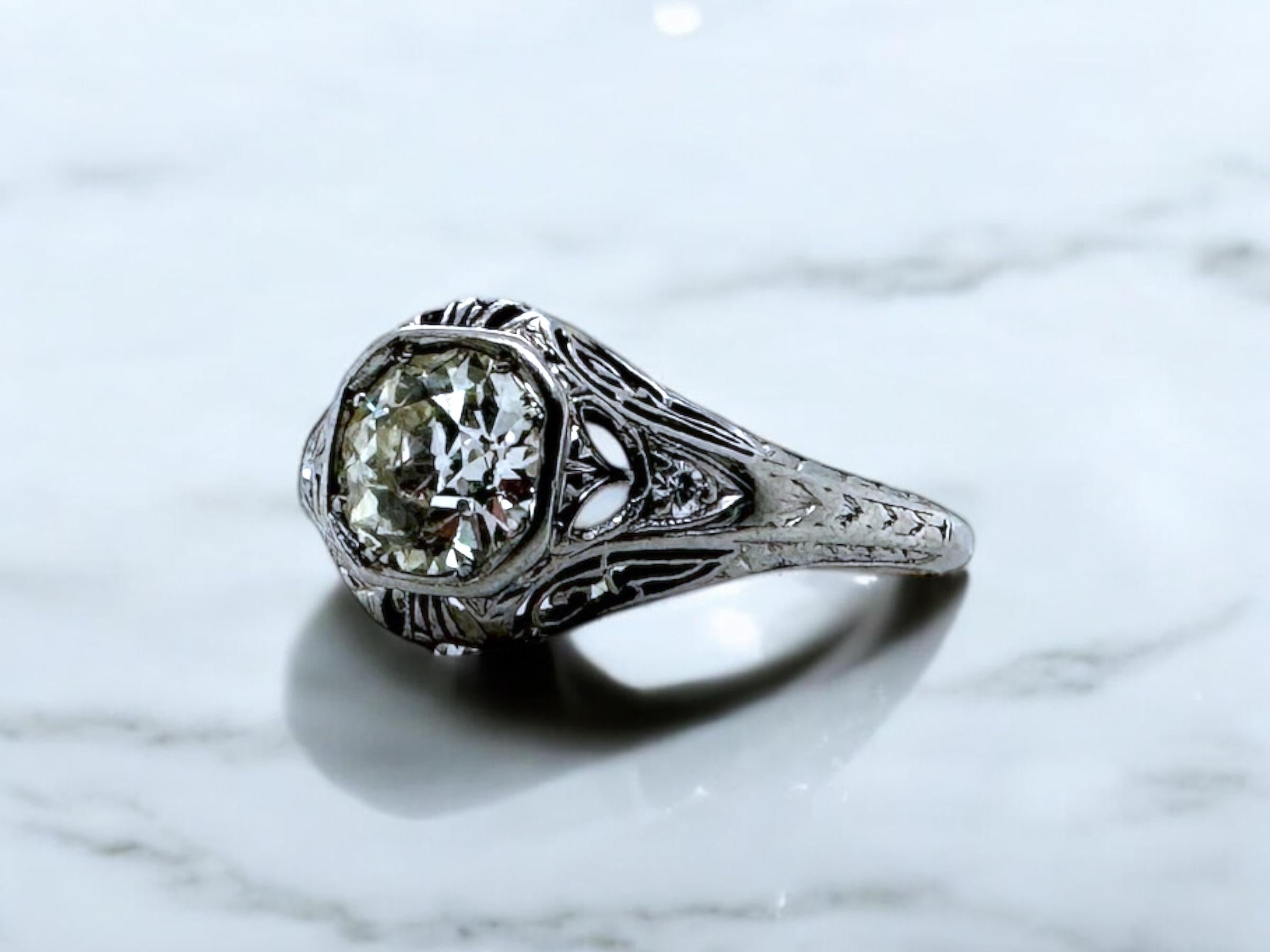 We are loving the stunning details on this beautiful vintage engagement ring!!

Ring Details
Material: Platinum
Era: Art Deco 1920 - 1940
Head Width: 9.9mm
Head Height: 4.7mm
Shank Width: Tapering to 1mm
Weight: 2.8 Grams
Finger Size: 8
Sizable Upon