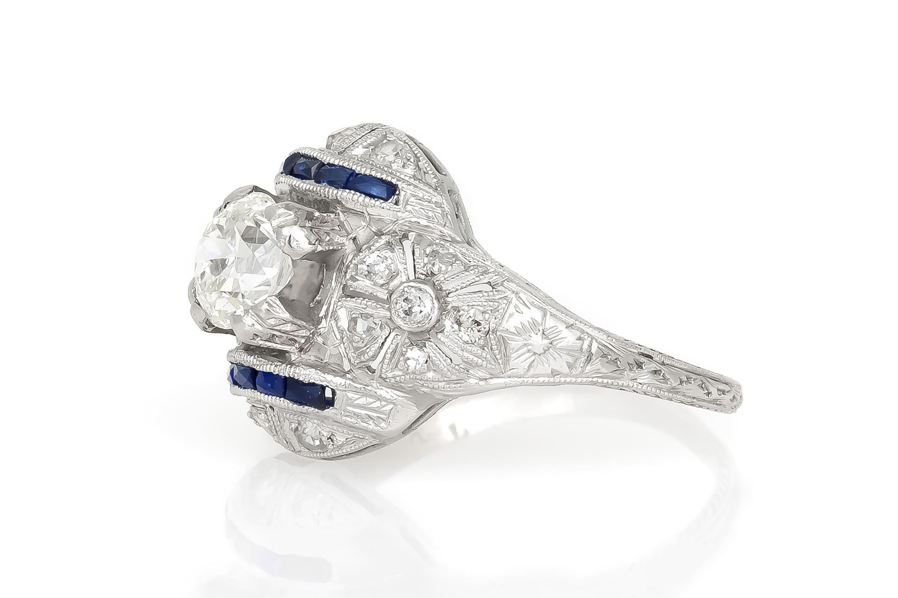 Finely crafted in platinum with an Old European cut Diamond weighing approximately 1.00 carat.
J color, SI2 clarity
The ring features French cut Sapphires and small Diamonds on the setting.
Art Deco, circa 1920s
Size 7, resizable