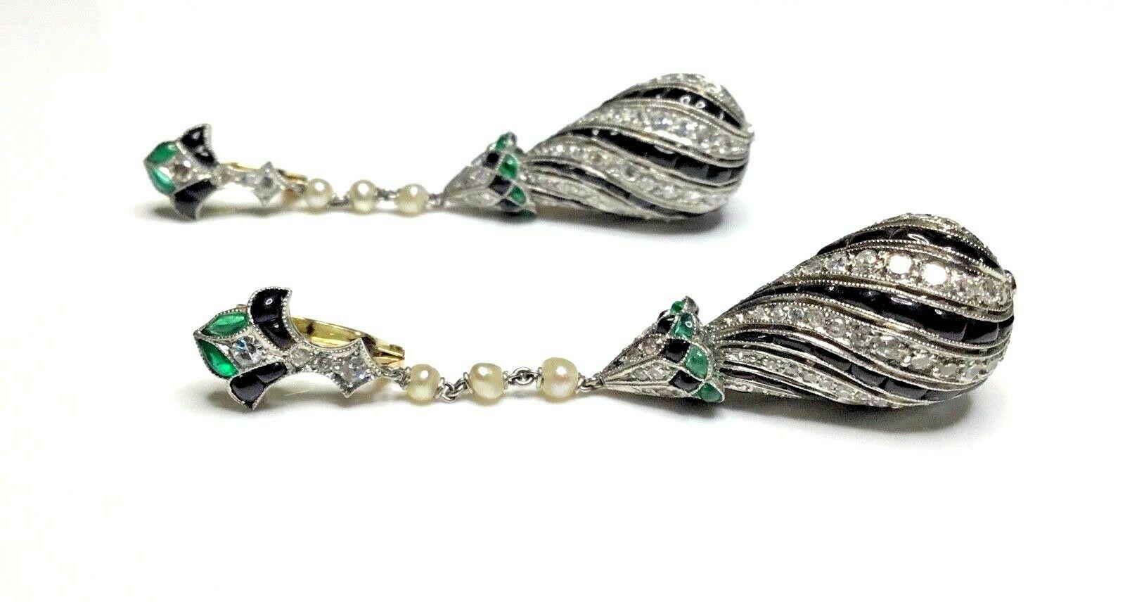 Estate Antique Art Deco 10.00 CTW Diamond Emerald Onyx Platinum Dangle Earrings

There Are Two Hundred Round Old Cut Natural Diamonds, Weighing Approximately 4.00 Carat Total Weight.

Color Grade: G-H
Clarity Grade: SI1


Twenty Four Natural