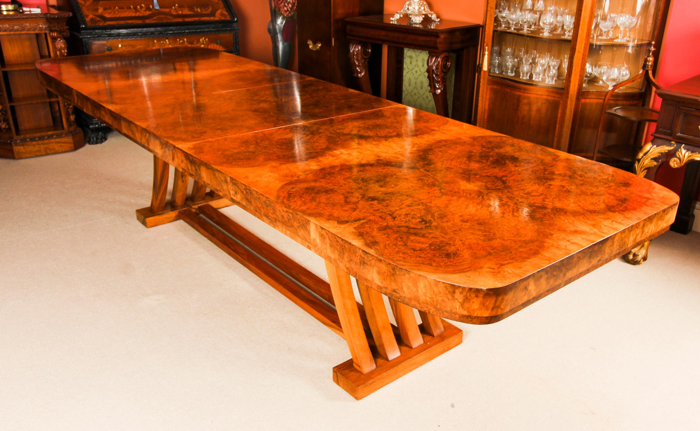 This is a beautiful and rare large antique Art Deco dining table designed by Salaman Hille, for Hille & Co. Ltd., Circa 1920 in date.

Crafted in burr walnut with a shaped multiple strut base the table has a leaf that folds away when not required