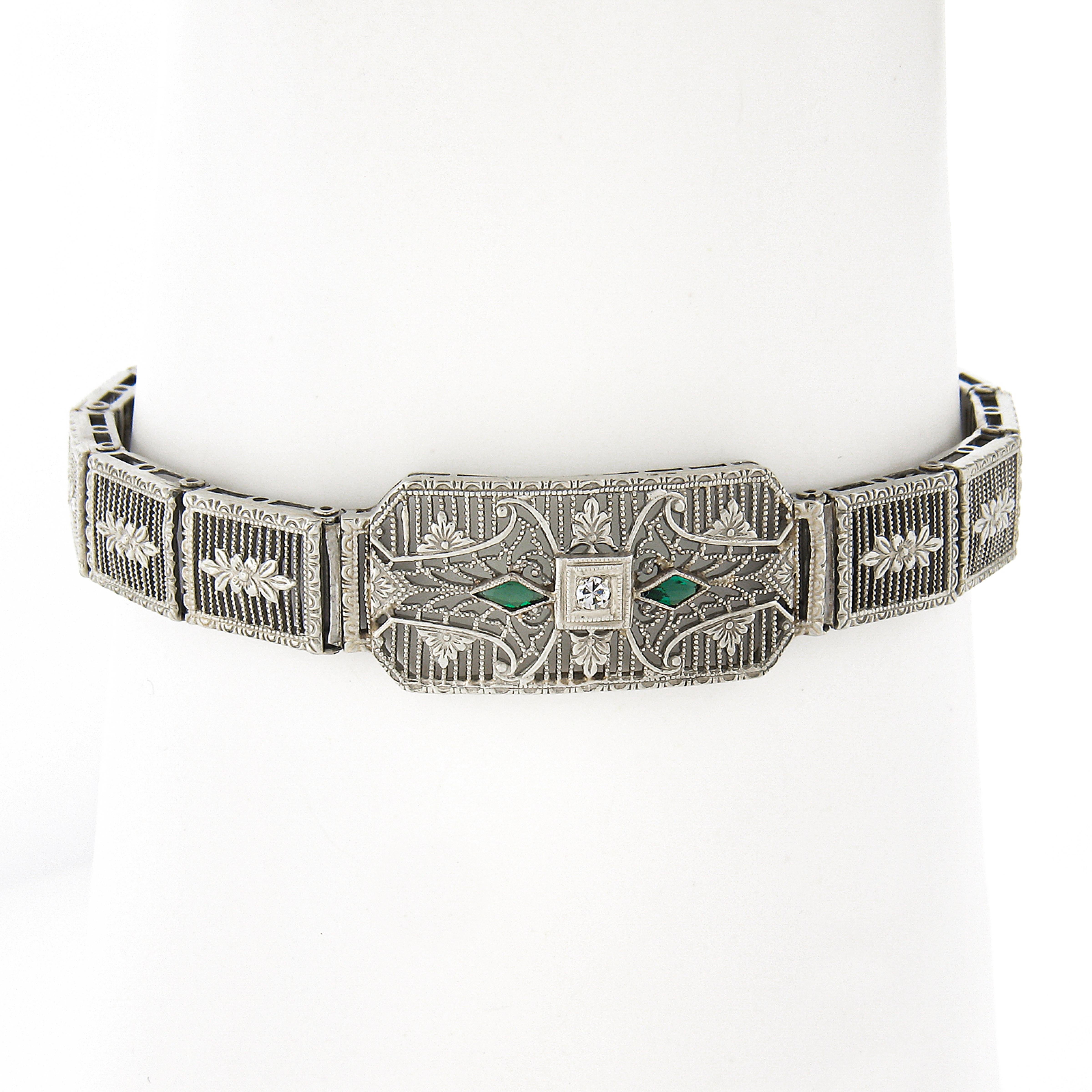 Here we have a magnificent antique belly link bracelet crafted from solid 10k white gold during the art deco period. The bracelet is completely covered with outstanding open filigree work and etched floral designs throughout, featuring a wide piece