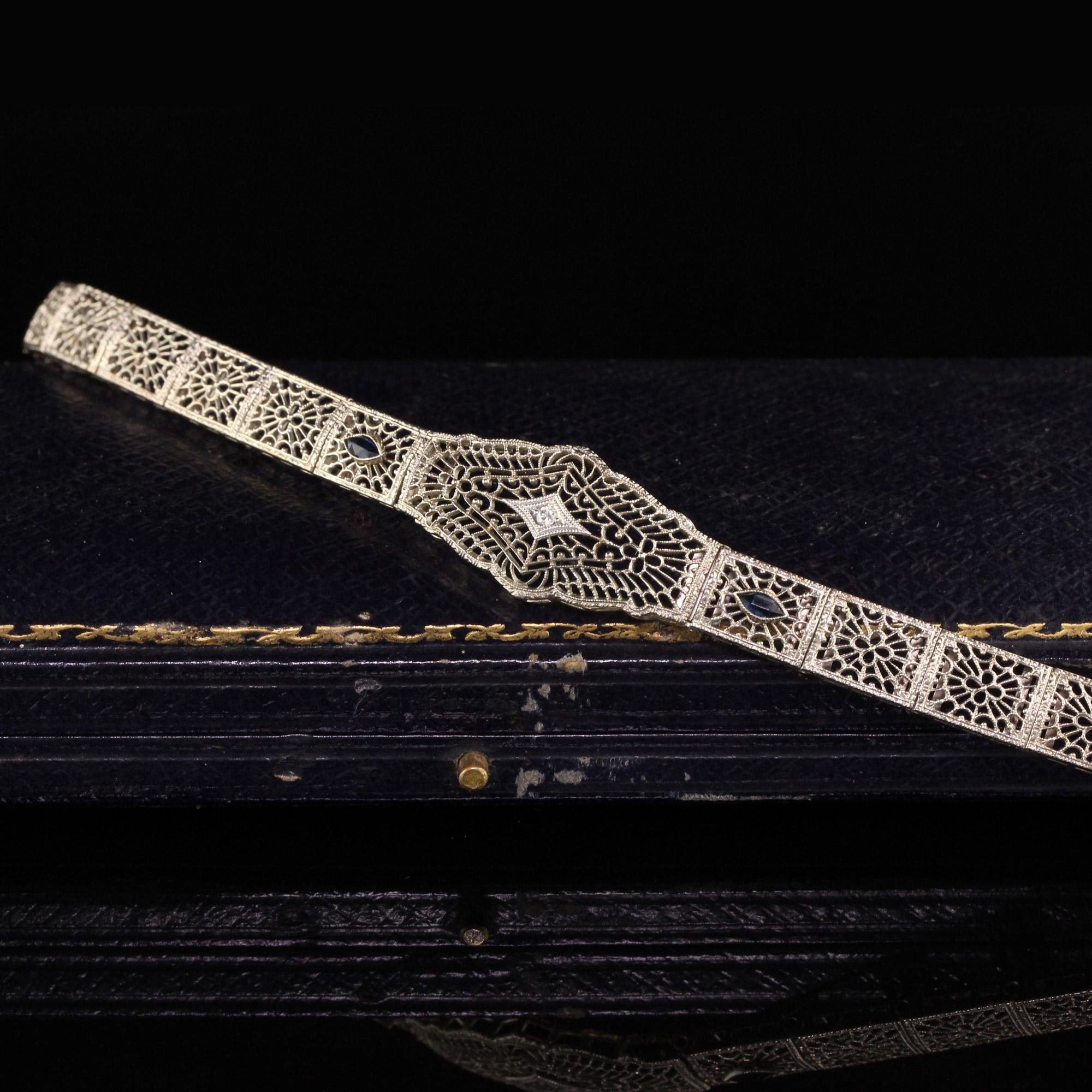 Stunning Antique Art Deco 10K White Gold Diamond and Sapphire Filigree Bracelet. This bracelet is in amazing condition and has gorgeous filigree work throughout the entire bracelet. 

Item #B0036

Metal: 10K White Gold

Weight: 11.6 Grams

Total