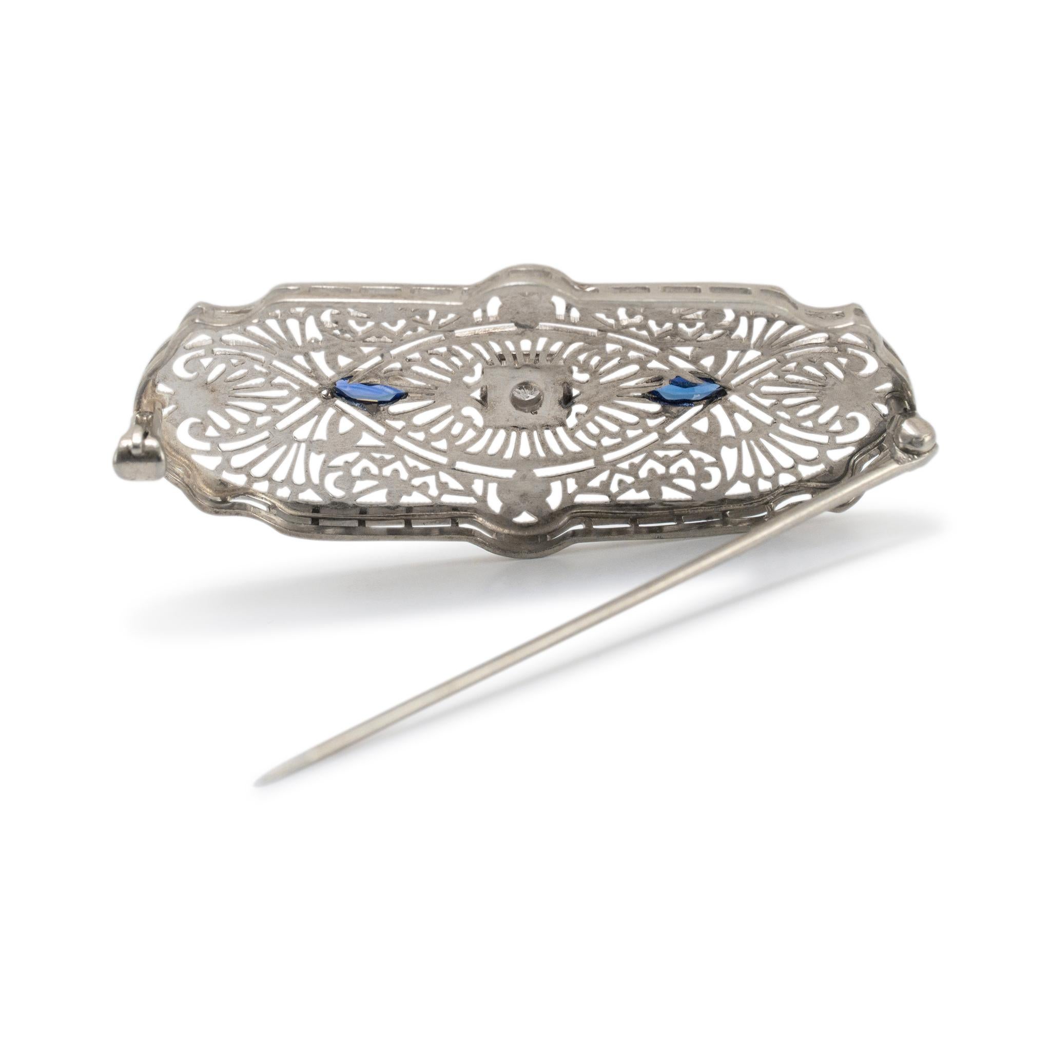 Gender: Ladies

Metal Type: 10K White Gold

Length: 19.00 mm

Width: 1.75 inches

Weight: 4.15 grams

One ladies 10K white gold diamond and sapphire art deco (1920-1930) brooch. The metal was tested and determined to be 10K white gold. In excellent