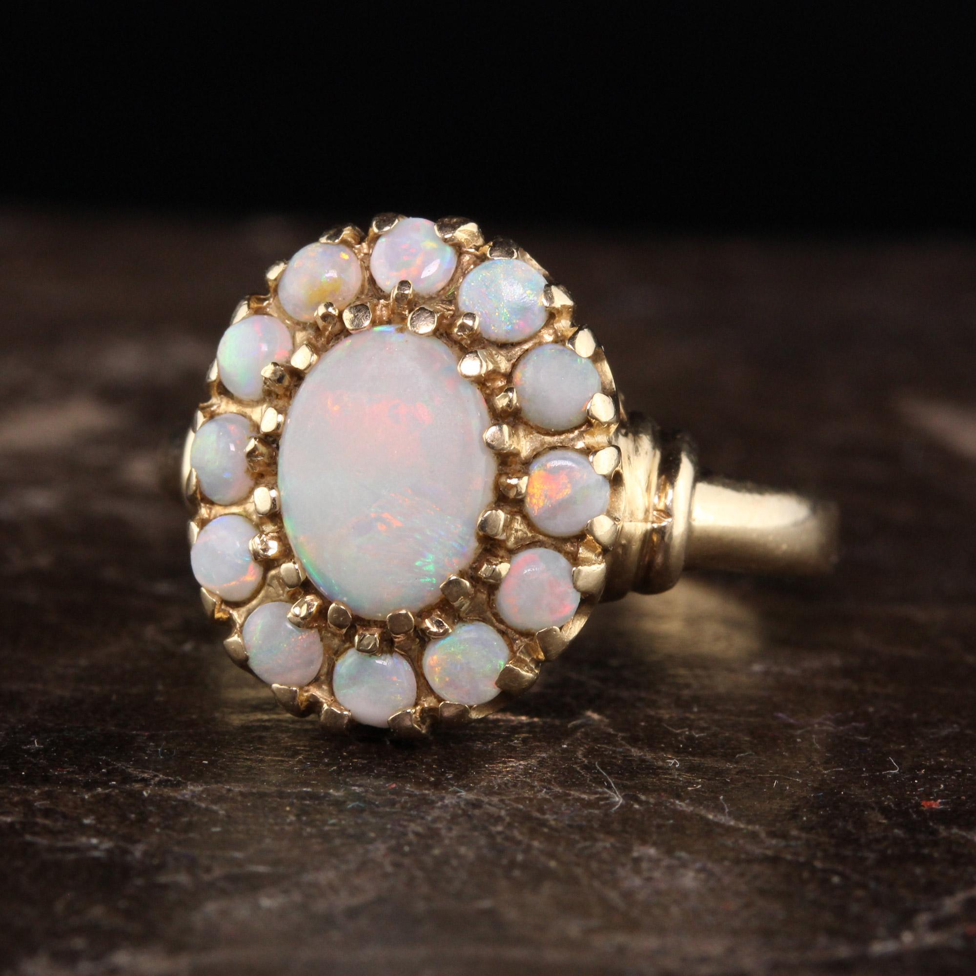 Beautiful Antique Art Deco 10K Yellow Gold Opal Engagement Ring. This beautiful ring has opal around a center opal with beautiful flashes of color. The stones are in great shape and none are chipped.

Item #R1044

Metal: 10K Yellow Gold

Weight: 3.3