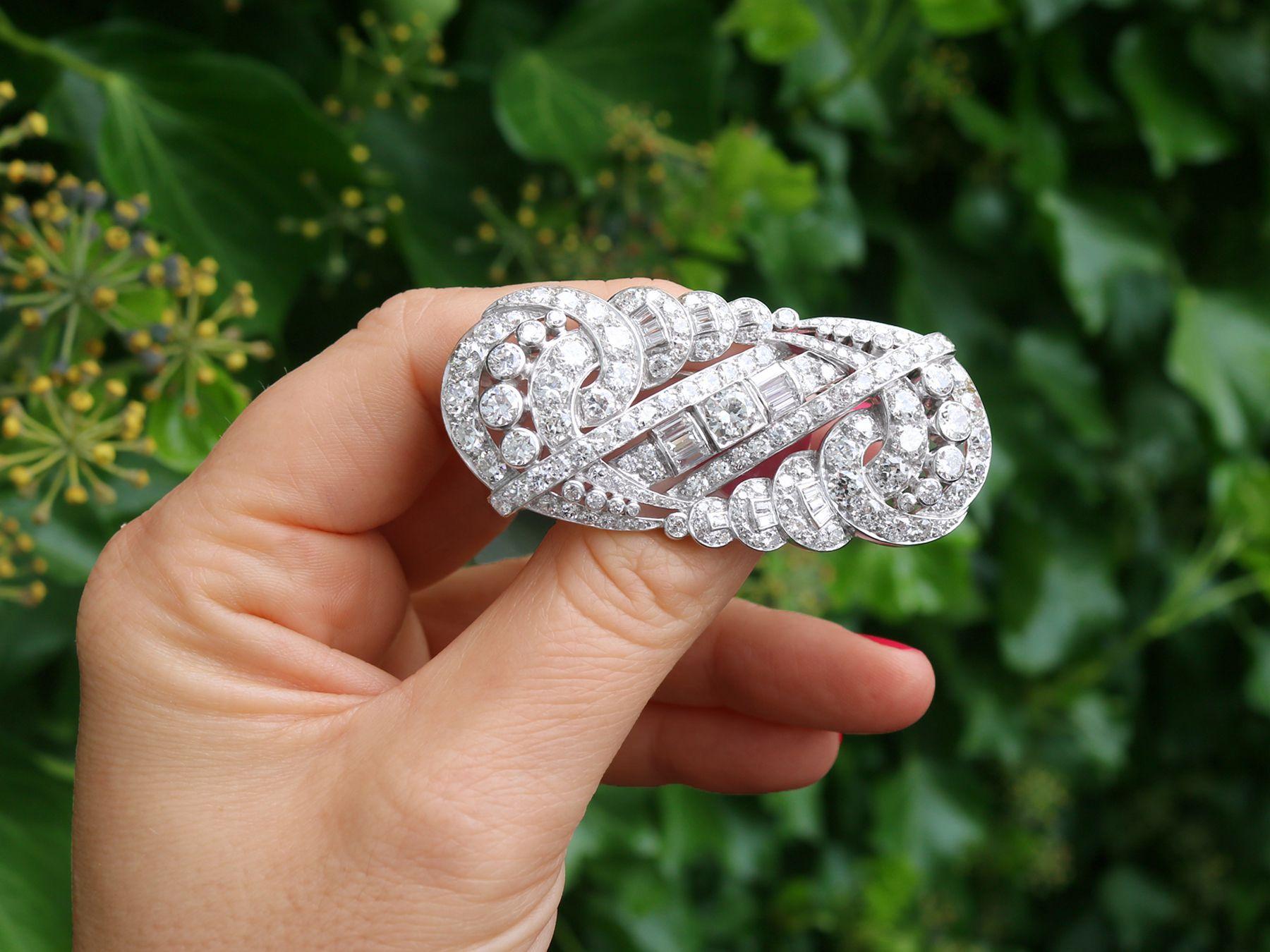 A stunning antique Art Deco 12.64 carat diamond and platinum brooch; part of our diverse antique jewelry and estate jewelry collections.

This stunning, fine and impressive Art Deco brooch with diamonds has been crafted in platinum.

The Art Deco
