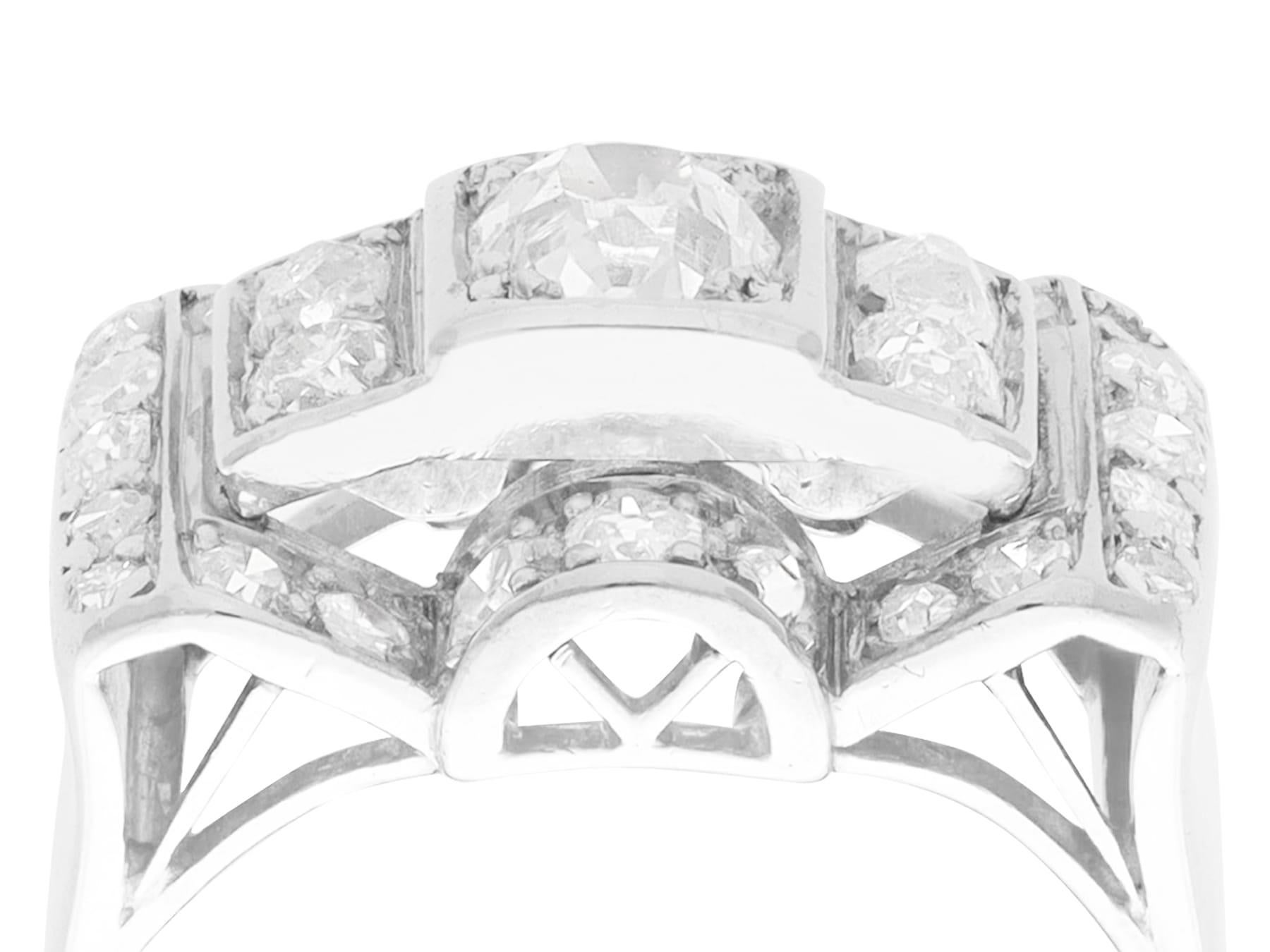 A fine and impressive 1.45 carat diamond, 18 karat white gold and platinum set Art Deco cocktail ring; part of our diverse diamond jewelry and estate jewelry collections.

This fine and impressive 1930s diamond ring has been crafted in 18k white