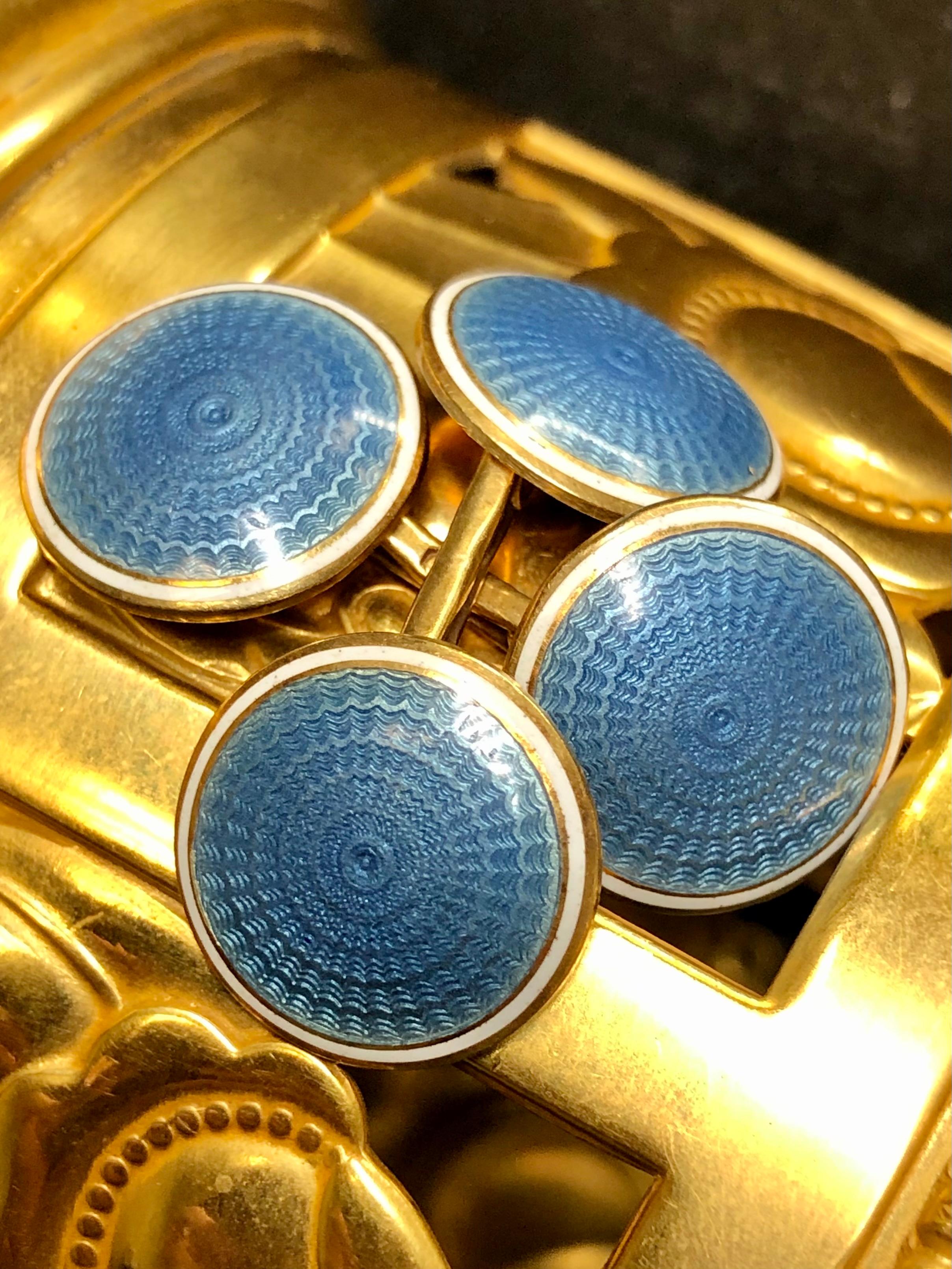 Original Art Deco cufflinks done in 14K yellow gold and finished in blue and white guilloché enamel with golden borders.


Dimensions/Weight:

Spheres measure .60” in diameter and weigh 9.3g.


Condition:

Enamel is in exceptional condition. No