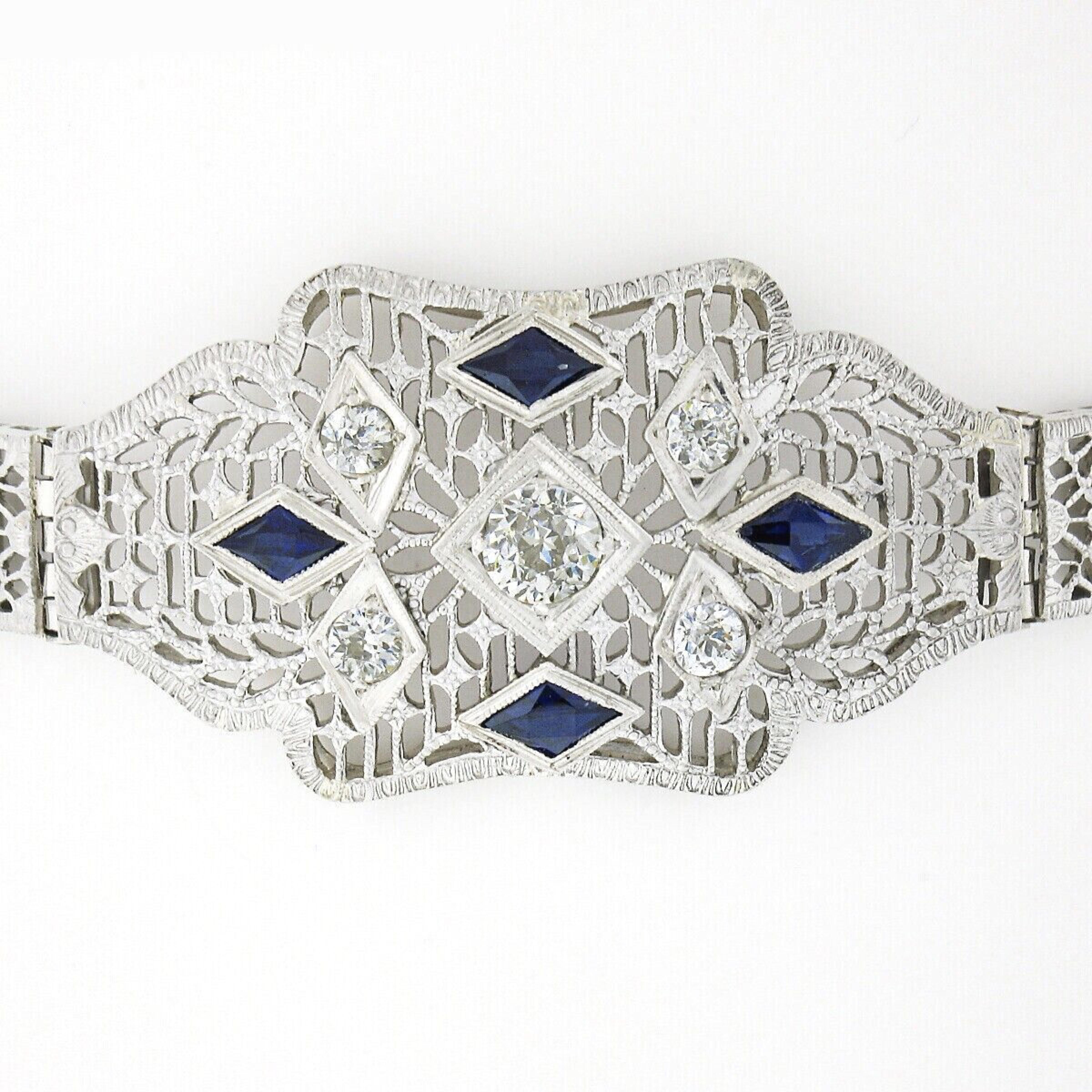 Here we have an absolutely breathtaking antique bracelet that was crafted from solid 14k white gold and platinum during the art deco period. It features magnificently executed floral open filigree work at each link covered with delicate milgrain