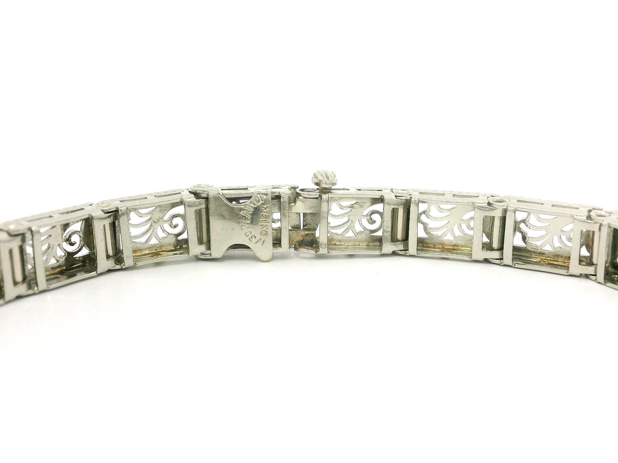 –Stone(s)–
(1) Natural Genuine Diamond - Old European Cut - Pave Set - H Color - VS2 Clarity - 0.02ctw (approx.)
(2) Synthetic Sapphire - Lozenge French Cut - Milgrain Bezel Set - Deep Blue Color 

Material: Solid 14k White Gold w/ Platinum
