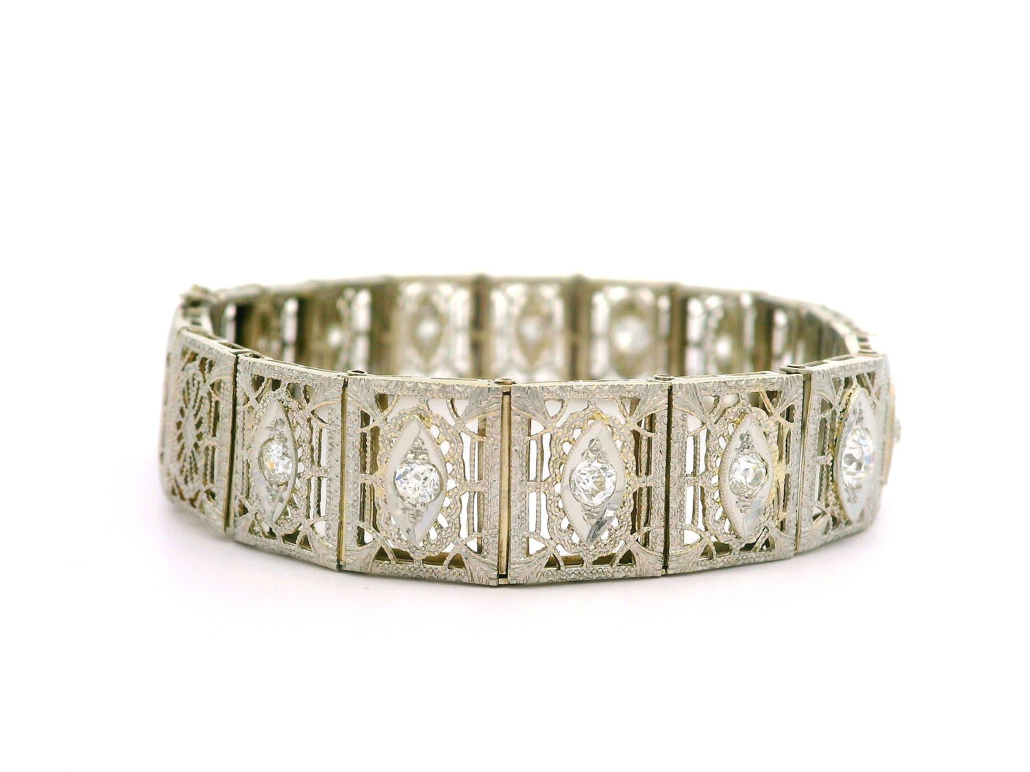 --Stone(s):--
(17) Natural Genuine Diamonds - Old Mine & Old European Cut - Pave Set - Mostly VS Clarity Some SI - G/H Color
Total Carat Weight: 2.0 (approx.)

Material: 14K Solid White Gold w/ Platinum Top
Weight: 17.90 Grams
Chain Type: Wide Open