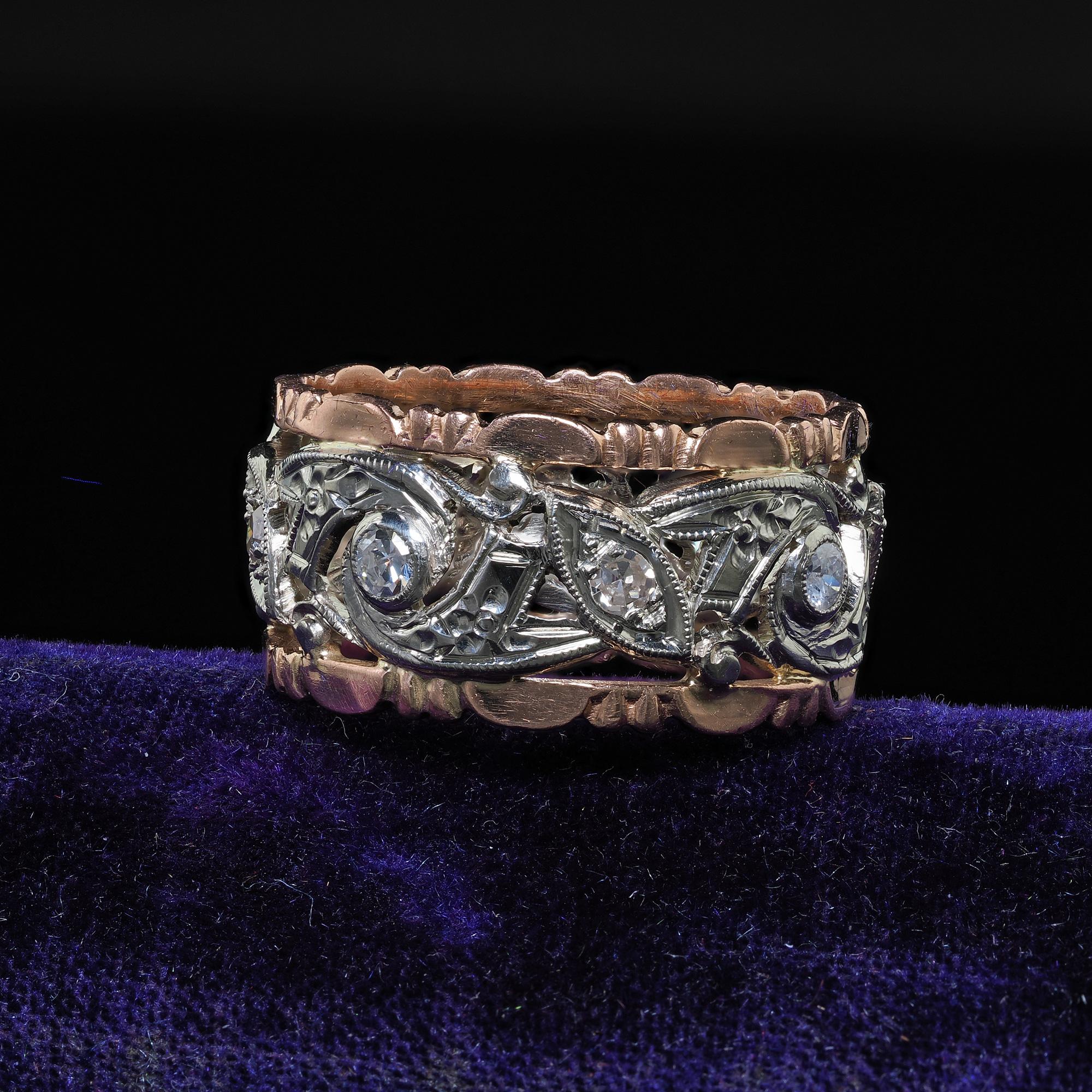 Beautiful Antique Art Deco 14K Rose and White Gold Single Cut Diamond Wide Wedding Band. This beautiful Art Deco diamond wedding band is crafted in 14k rose and white gold. The ring features old single cut diamonds set throughout the center of the