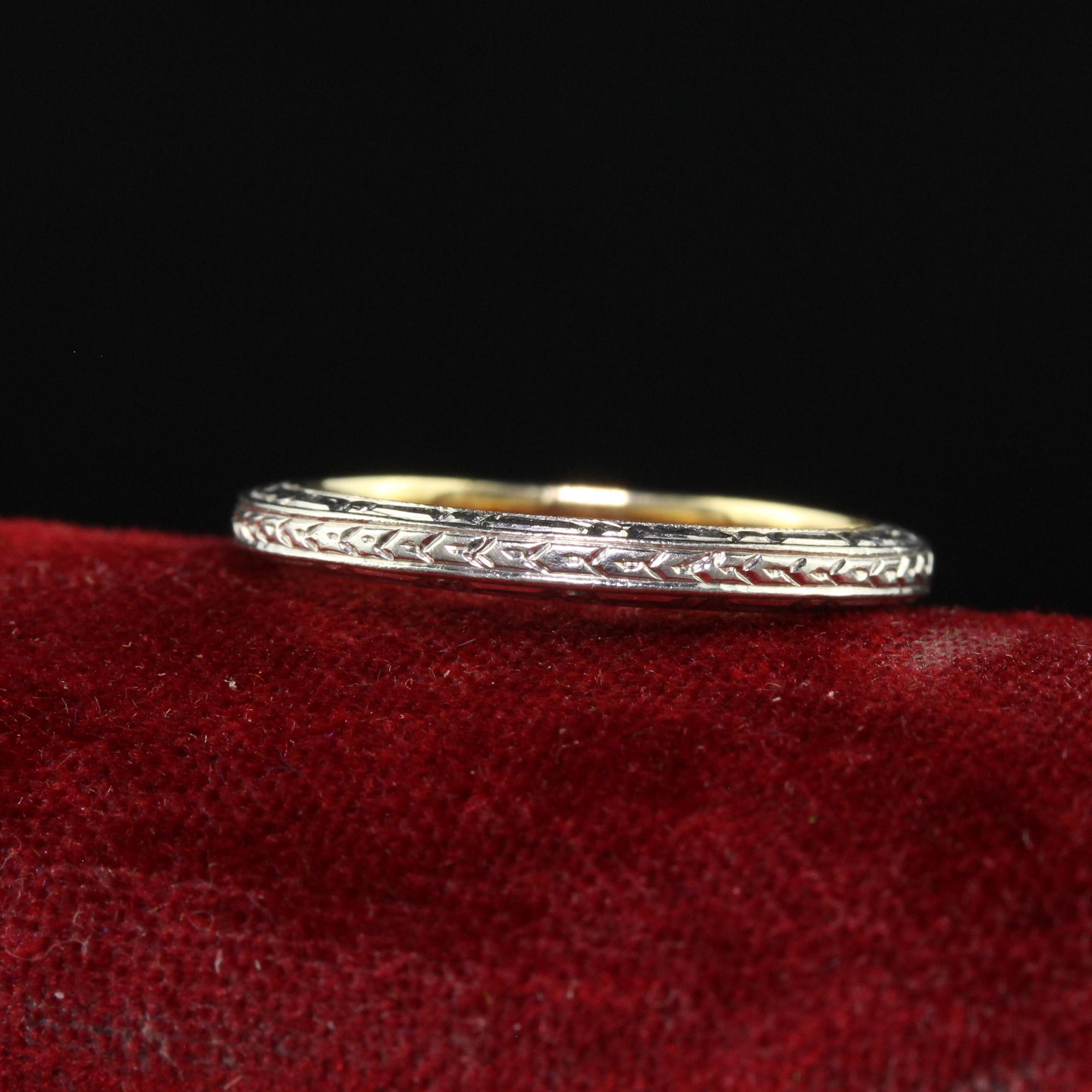 Beautiful Antique Art Deco 14K Two Tone Engraved Wedding Band - Size 5 1/4. This gorgeous art deco wedding band is crafted in 14k yellow gold and 18k white gold top. This band features gorgeous engravings on the top and sides. The ring has a 14k