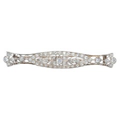 Broche antique Art déco en or bicolore 14 carats, avec filigrane et milgrain, sertie d'un diamant de 2,75 carats