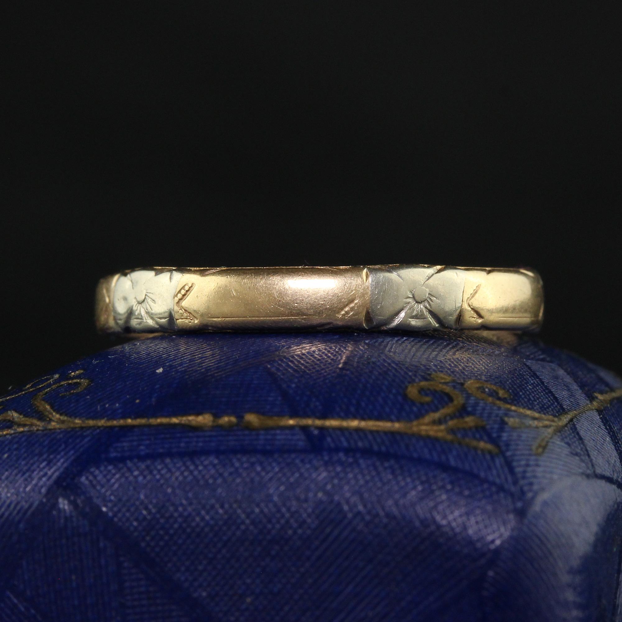 Beautiful Antique Art Deco 14K Two Tone Yellow Gold Engraved Wedding Band - Size 9. This classic wedding band is crafted in 14k yellow gold and white gold. This ring features a faded blossom pattern around the entire ring on the white gold sections