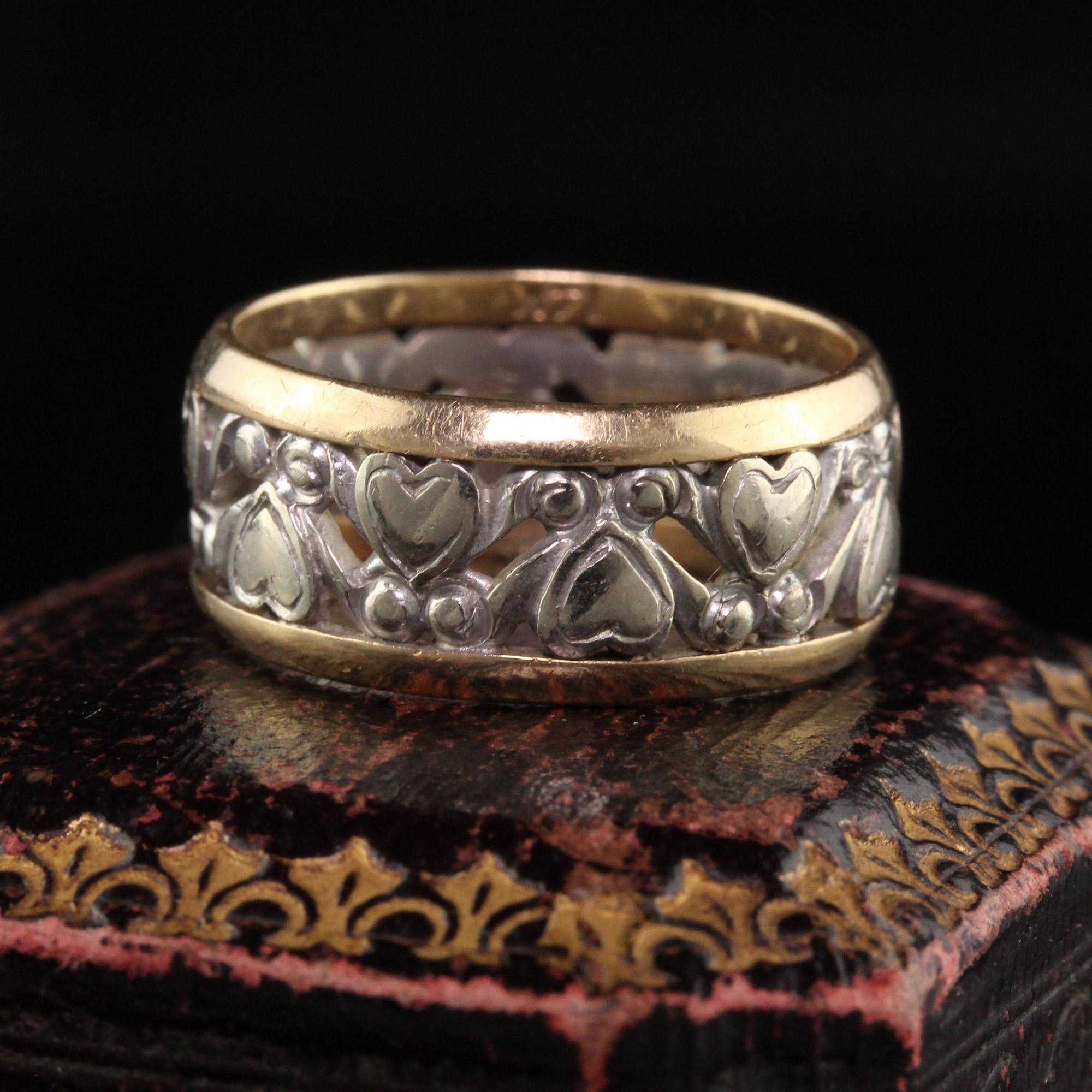 Beautiful Antique Art Deco 14K White and Yellow Gold Wide Heart Wedding Band. This beautiful wedding band has hearts carved out of white gold in the center and yellow gold sides. It is a very unique ring.

Item #R1153

Metal: 14K White and Yellow