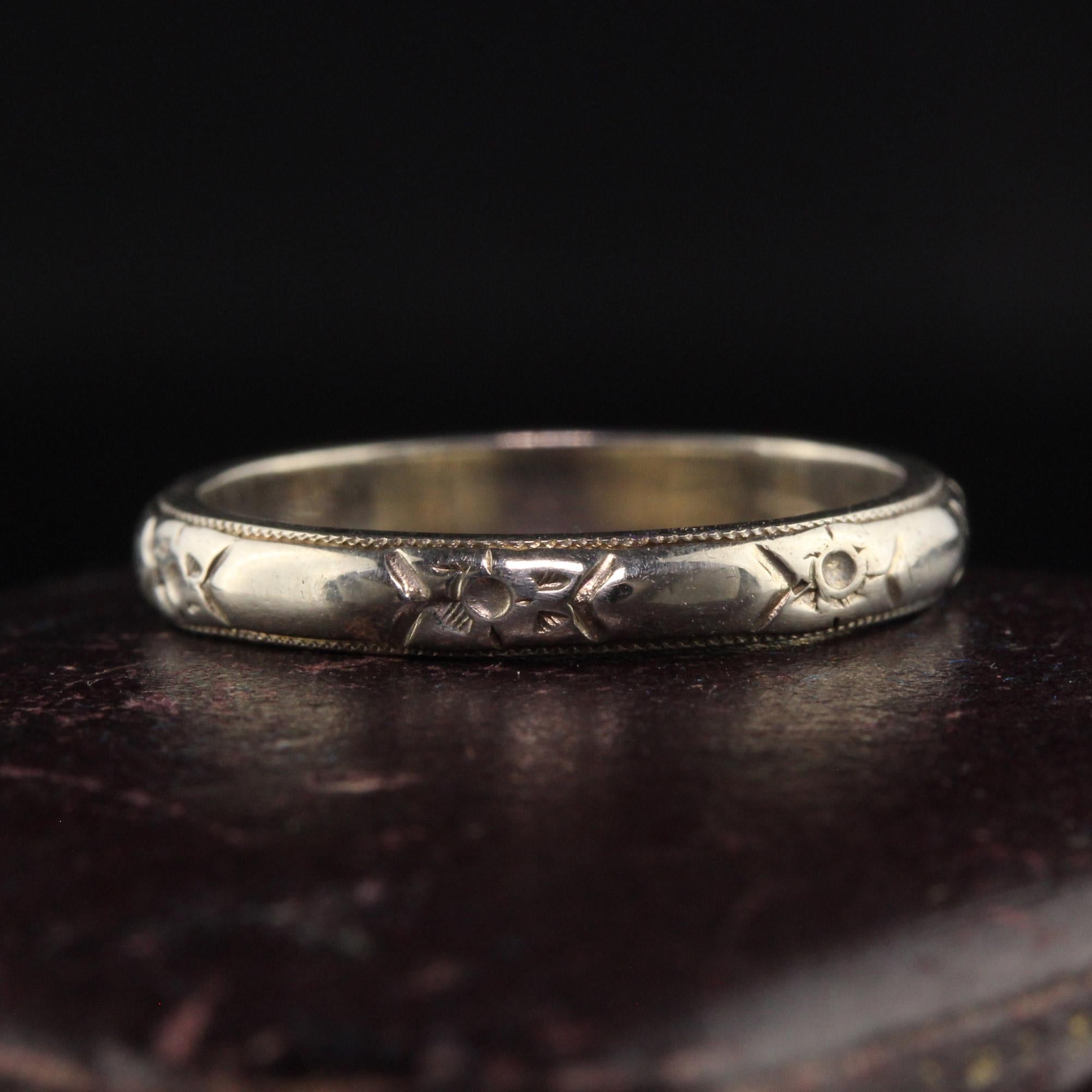 Beautiful Antique Art Deco 14K White Gold Blossom Engraved Wedding Band. This incredible classic wedding band has blossom engravings around the entire band.

Item #R1136

Metal: 14K White Gold

Weight: 2.1 Grams

Size: 4 1/2

Measurements: Top of