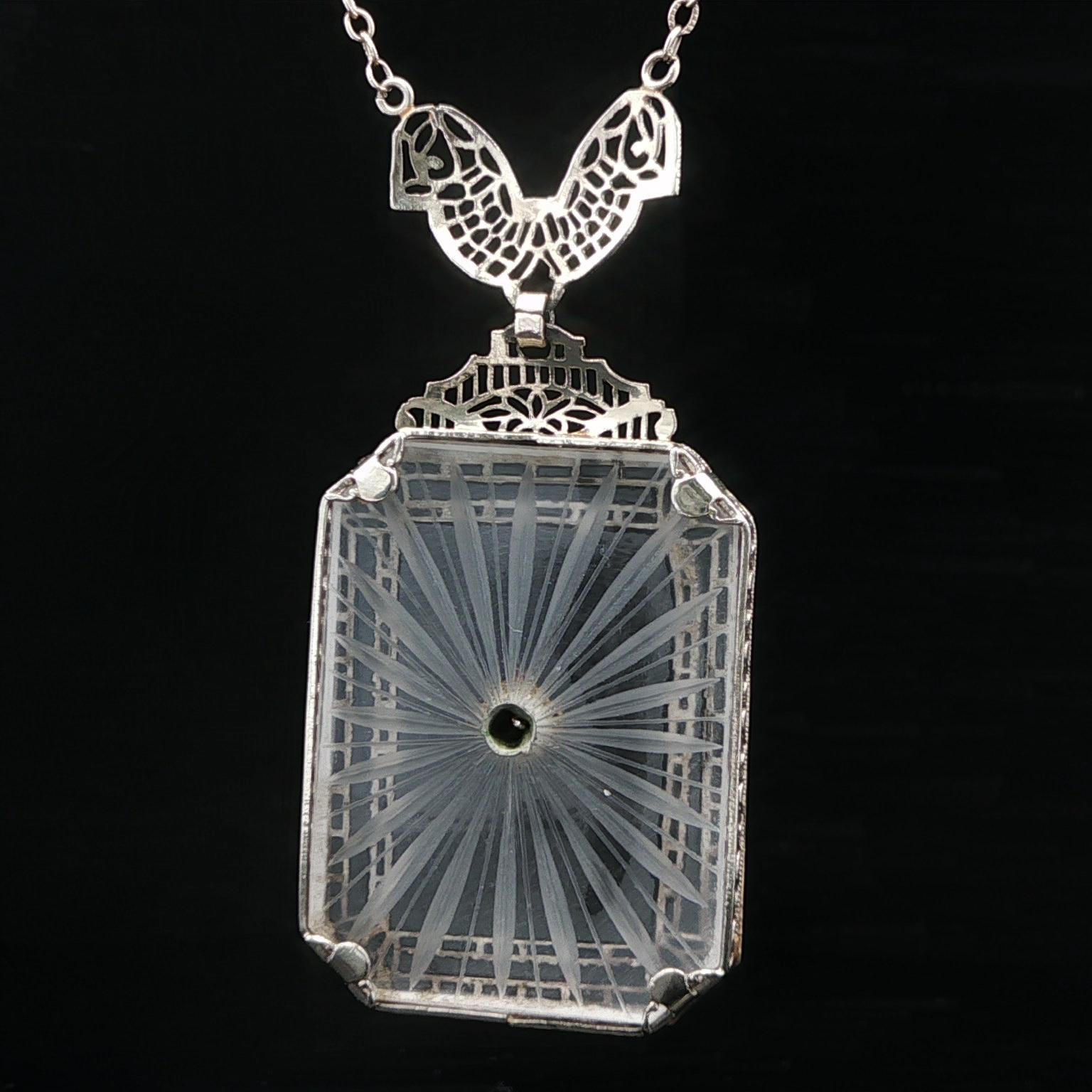 Antique Art Deco White Gold Filigree Work Pendant with Original Antique Link Chain. 
--Stone(s):--
(1) Camphor Glass - Rectangular Cut with Cut Corners- Prong Set - White Color - 30x21.7mm (approx.)
(1) Natural Genuine Diamond - Single Cut - Pave