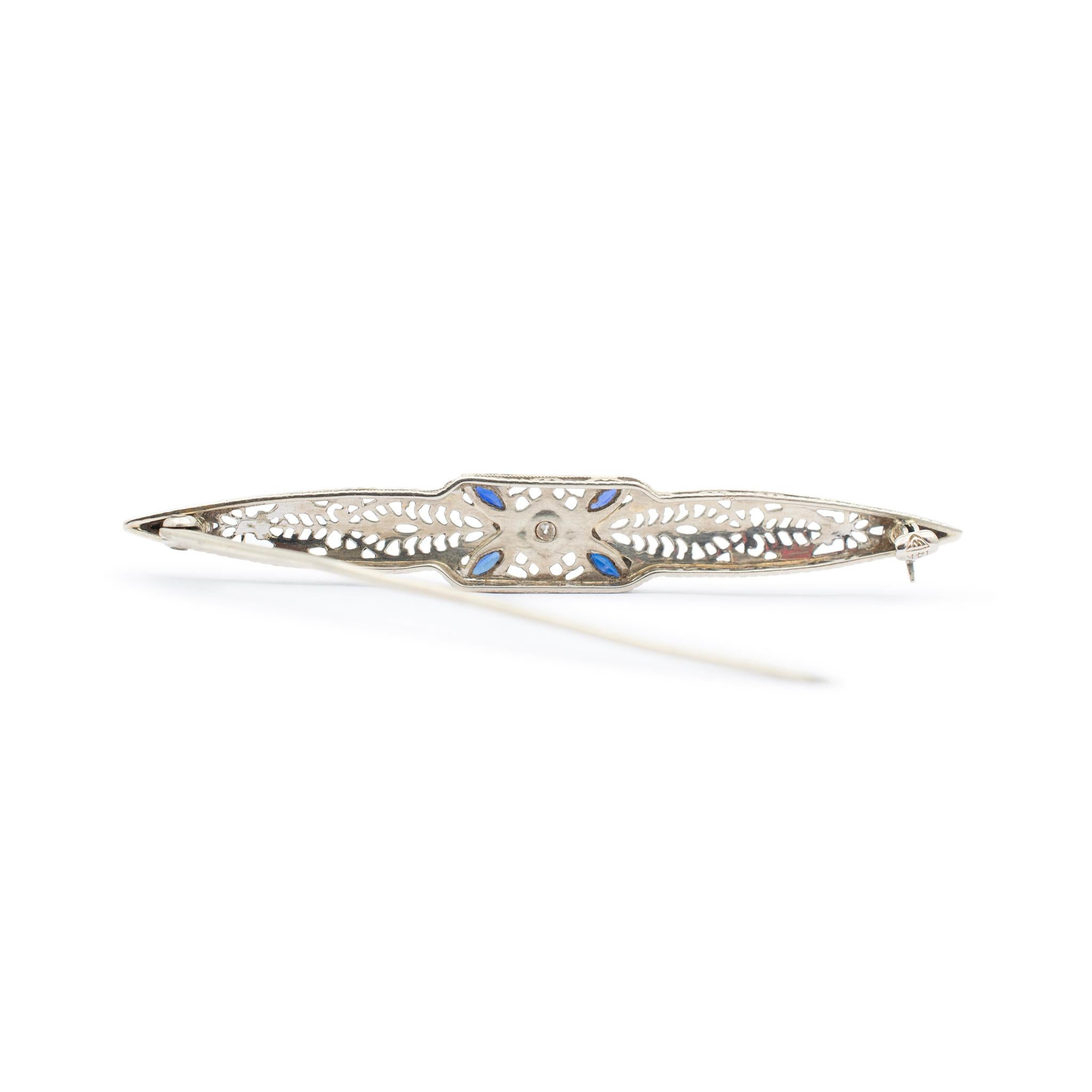 Metal Type: 14K White Gold

Length: 2.25 Inches

Width: 8.35 mm

Weight: 3.64 grams

Filigreed 14K white gold diamond and sapphire antique art-deco brooch. Engraved with 