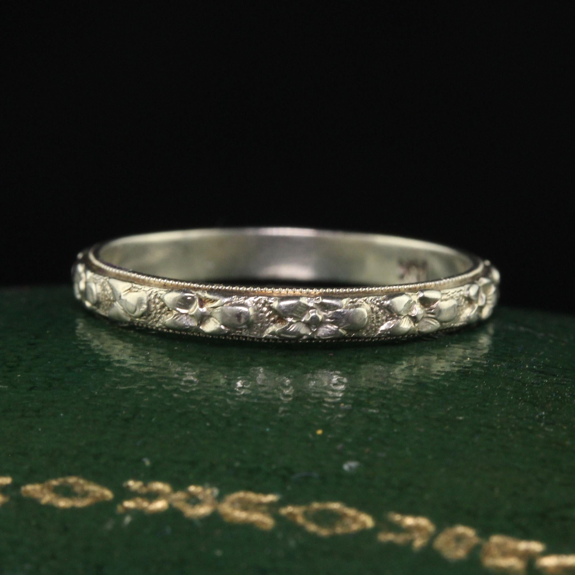 Beautiful Antique Art Deco 14K White Gold Floral Engraved Wedding Band - Size 6. This gorgeous wedding band is crafted in 14k white gold. The floral design is deeply engraved around the entire band and is in great condition. This ring can also be
