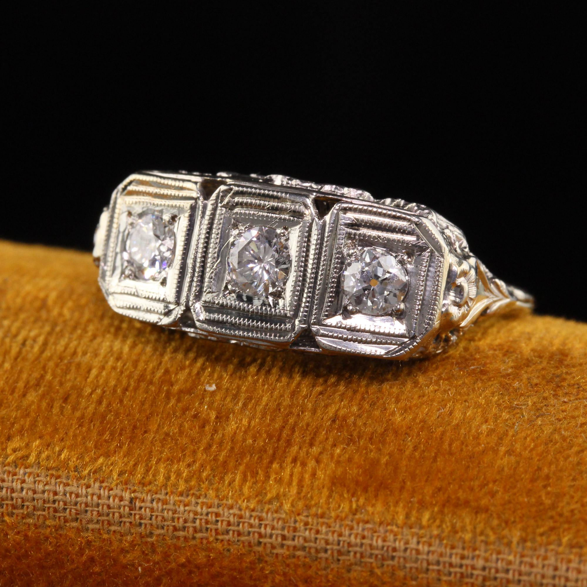 Beautiful Antique Art Deco 14K White Gold Old European Diamond Three Stone Ring. This classic three stone ring is crafted in 14k white gold. The diamonds are old european cut and are set in a Art Deco filigree mounting.

Item #R1240

Metal: 14K