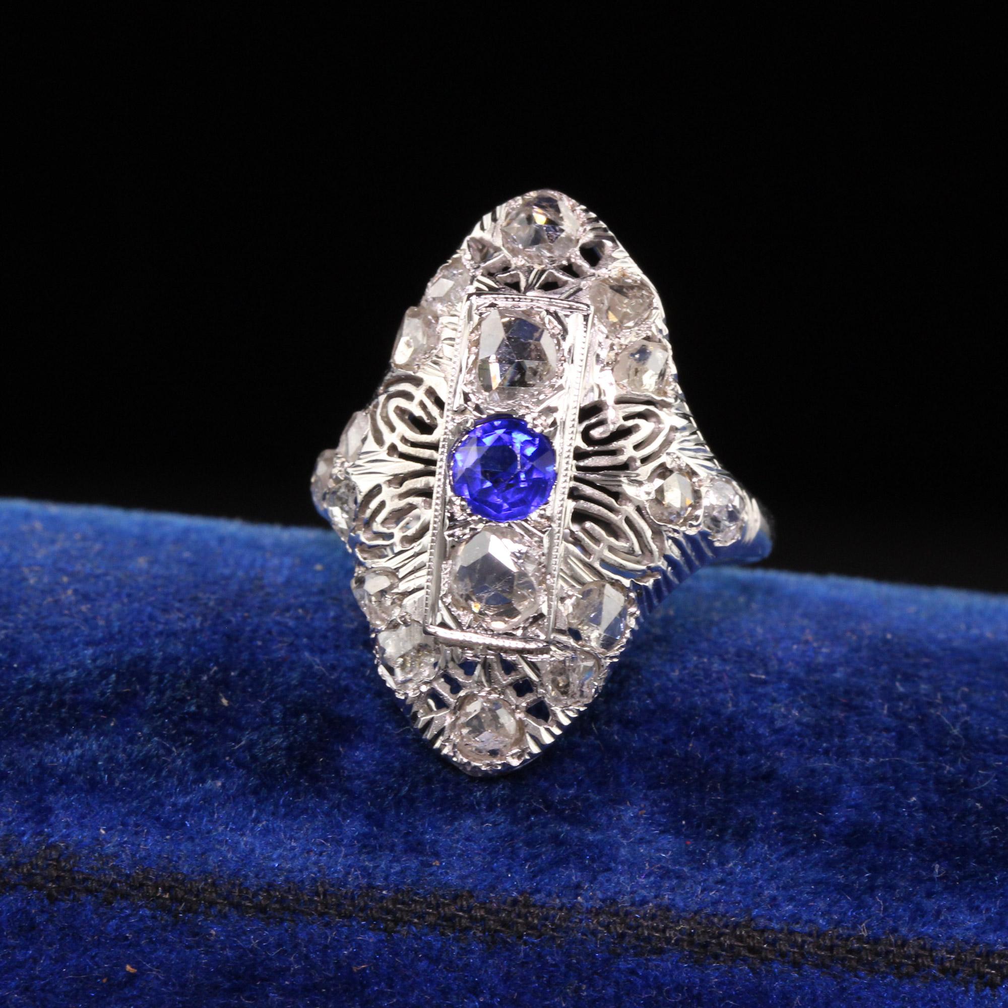 Beautiful Antique Art Deco 14K White Gold Rose Cut Diamond Filigree Shield Ring. This beautiful ring is crafted in 14k white gold. There are beautiful rose cut diamonds set in an Art Deco mounting with a synthetic sapphire in the center which was