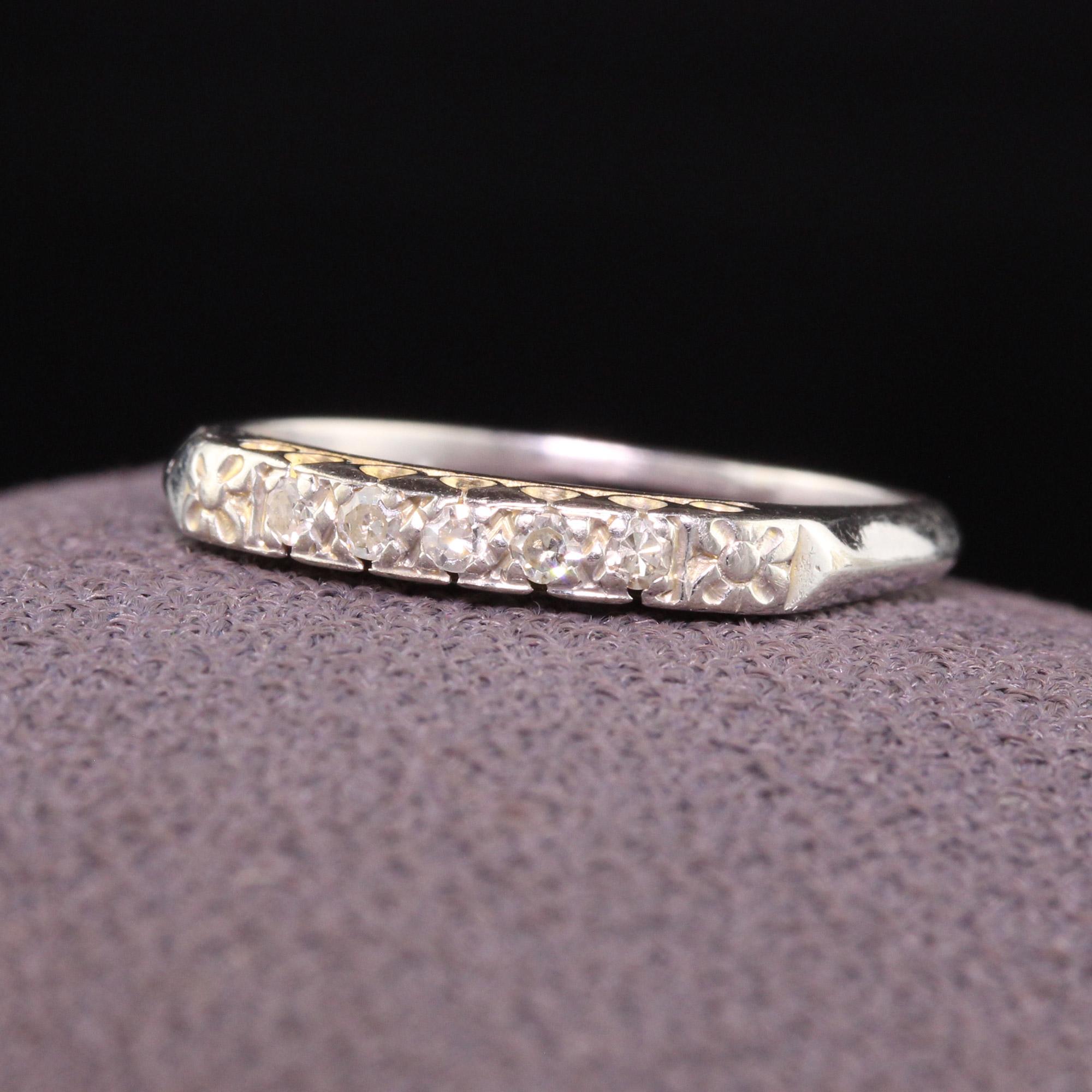 Beautiful Antique Art Deco 14K White Gold Single Cut Diamond Wedding Band. This classic wedding band is crafted in 14K white gold and has single cut diamonds on the top of the ring with floral engravings on each side.

Item #R1188

Metal: 14K White
