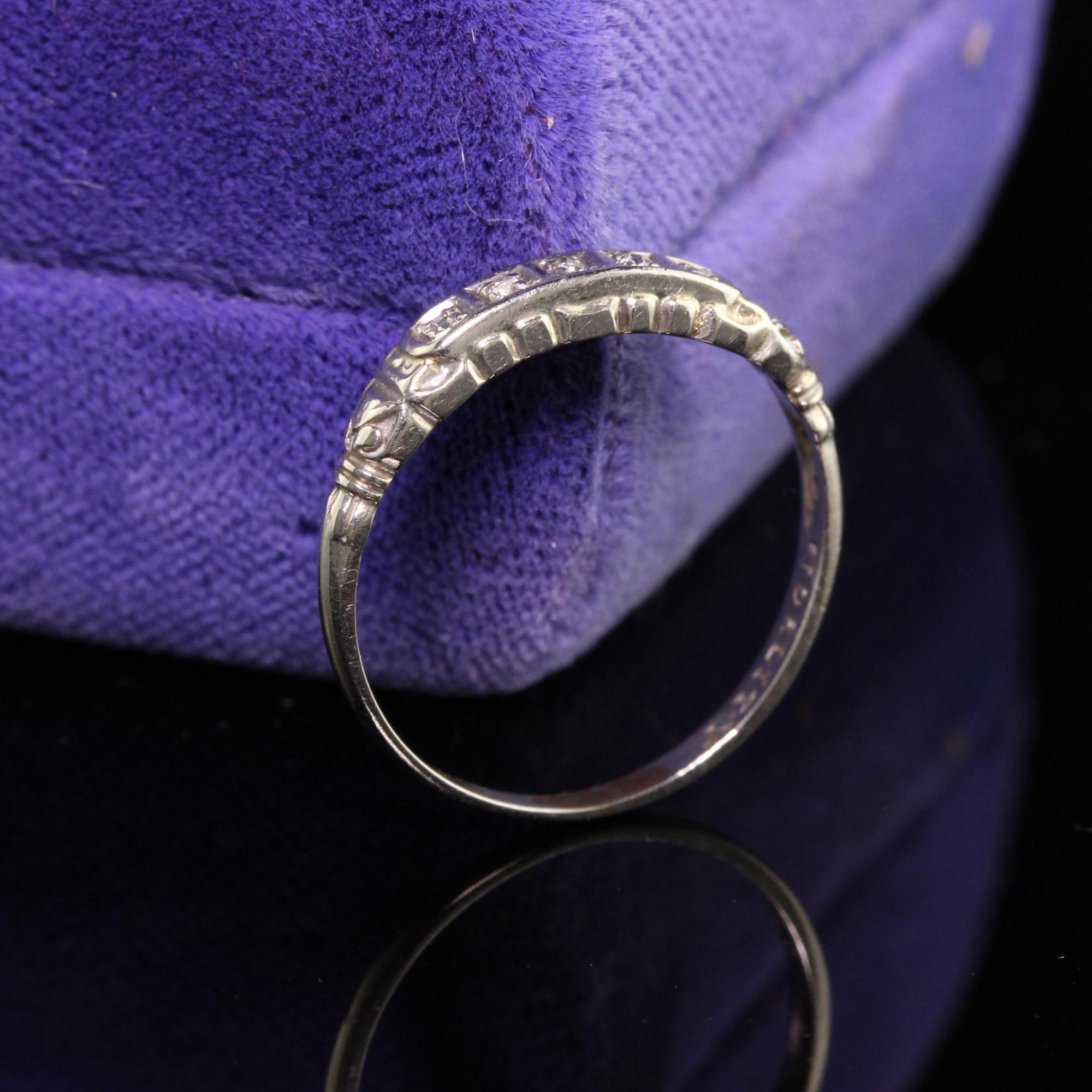 Beautiful Antique Art Deco 14K White Gold Single Cut Diamond Wedding Band - Size 5. This five stone wedding band features single cut diamonds set in an art deco band.

Item #R0952

Metal: 14K White Gold

Weight: 1 Grams

Diamond: Approximately .03