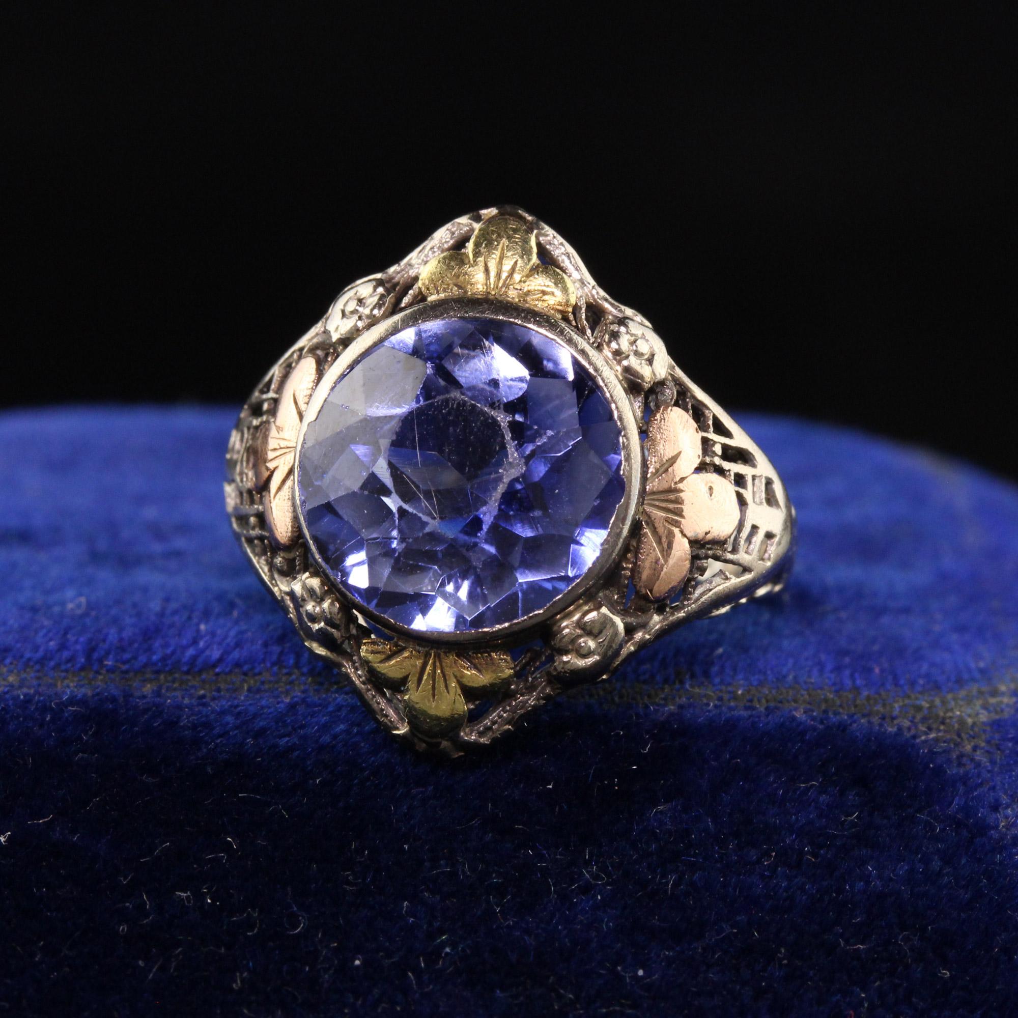 Beautiful Antique Art Deco 14K White Gold Tri Gold Filigree Ring.This beautiful art deco ring has a synthetic sapphire set in the center of a gorgeous mounting with yellow, white, and rose gold accents.

Item #R0991

Metal: 14K White Gold with