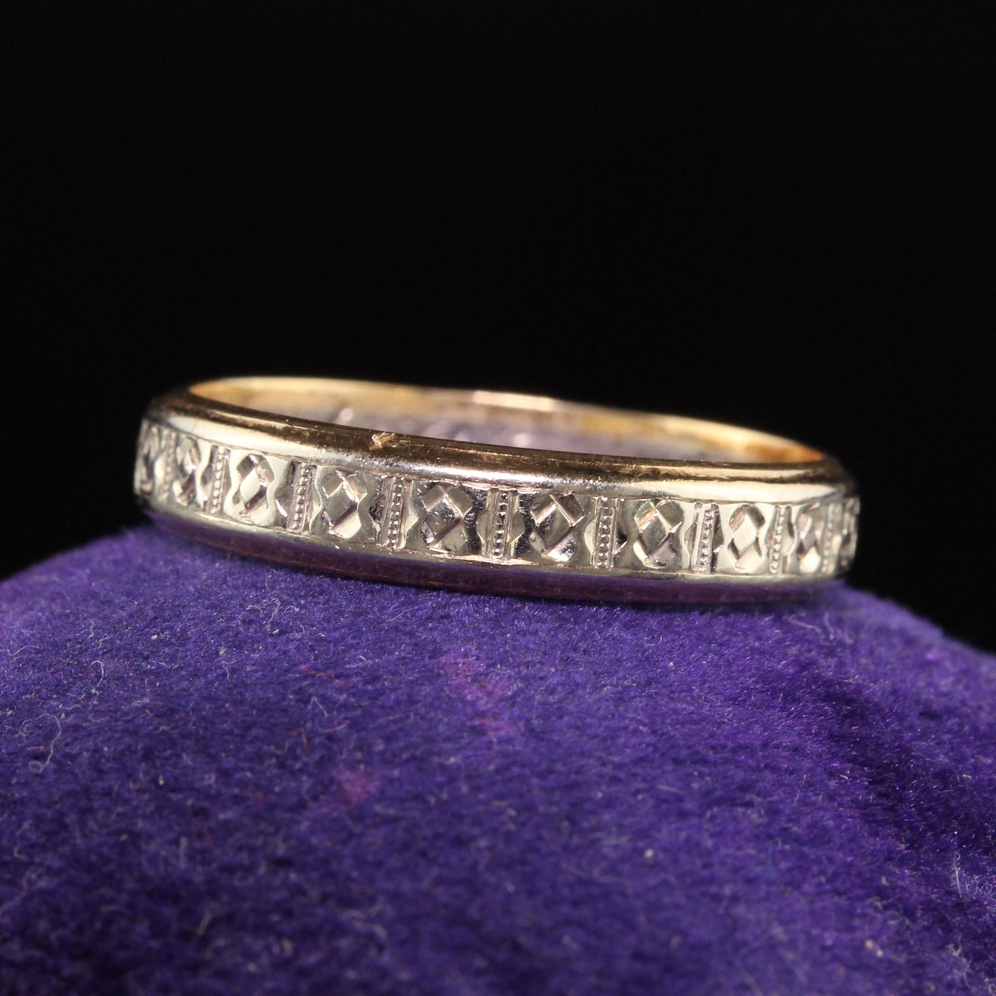 Beautiful Antique Art Deco 14K Yellow and White Gold Engraved Wedding Band. This beautiful wedding band is crafted in14K white and yellow gold and has engravings going around the entire ring. The inside of the band is engraved 