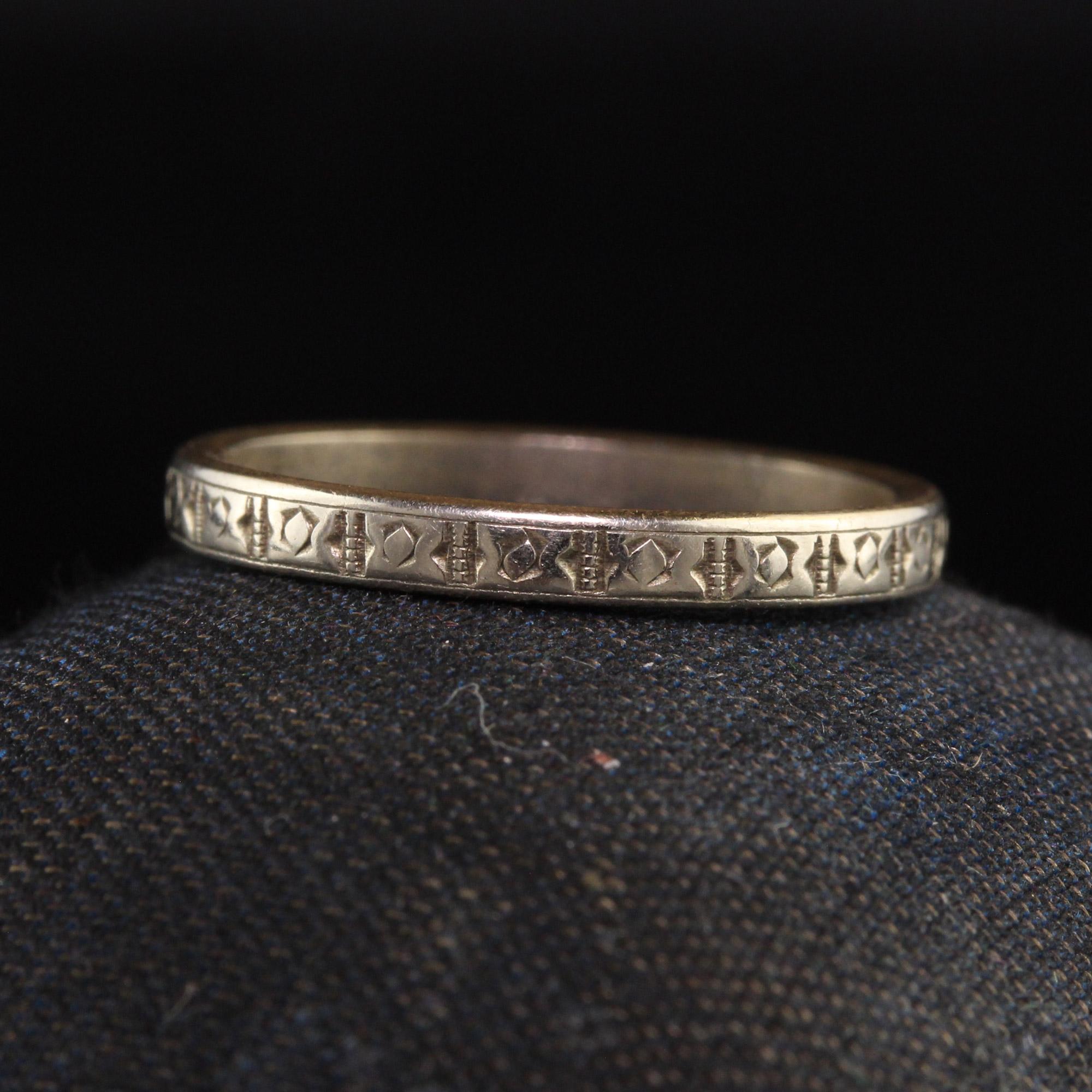 Beautiful Antique Art Deco 14K Yellow and White Gold Engraved Wedding Band. This beautiful band is crafted in 14k yellow gold and white gold top. It is beautifully engraved with a pattern around the entire band.

Item #R1133

Metal: 14K Yellow and