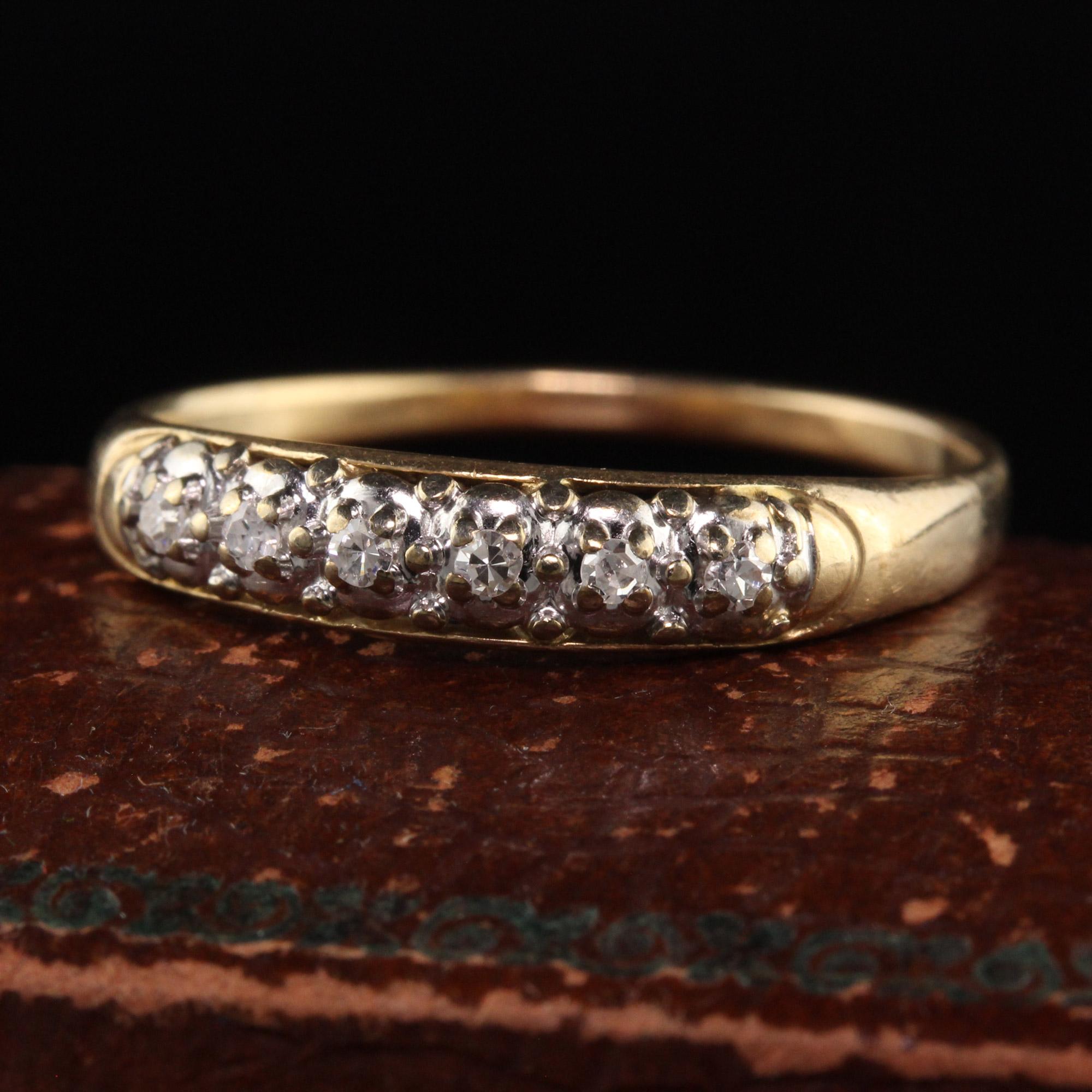 Beautiful Antique Art Deco 14K Yellow and White Gold Single Cut Diamond Wedding Band. This beautiful wedding band has single cut diamonds on the top of the band. It is crafted in 14K yellow gold and white gold top.

Item #R1165

Metal: 14K Yellow
