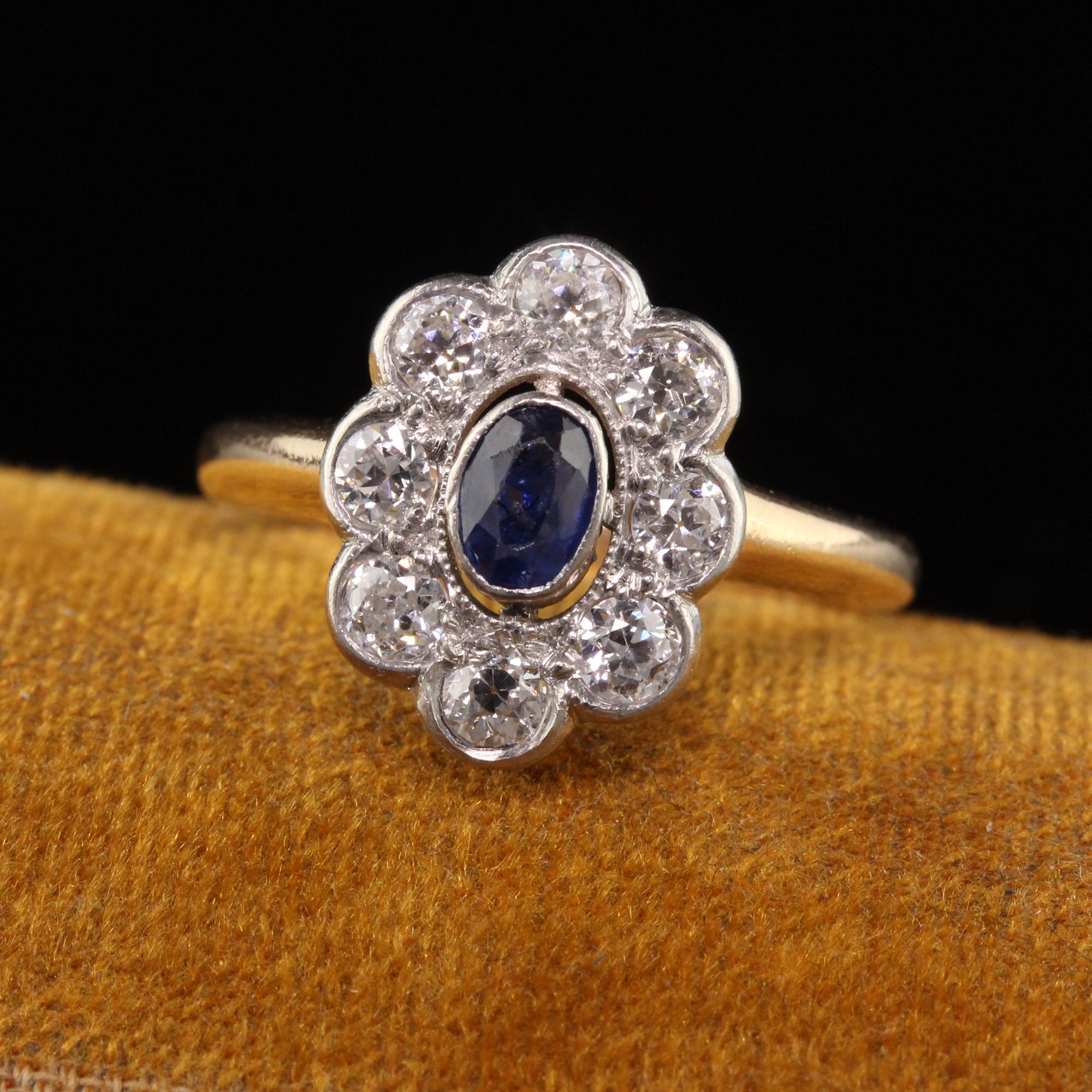 Beautiful Antique Art Deco 14K Yellow Gold and Platinum Old Euro Diamond and Sapphire Ring. This gorgeous ring is crafted in 14k yellow gold and platinum top. There are 8 white old european cut diamonds surrounding a natural oval sapphire. The ring
