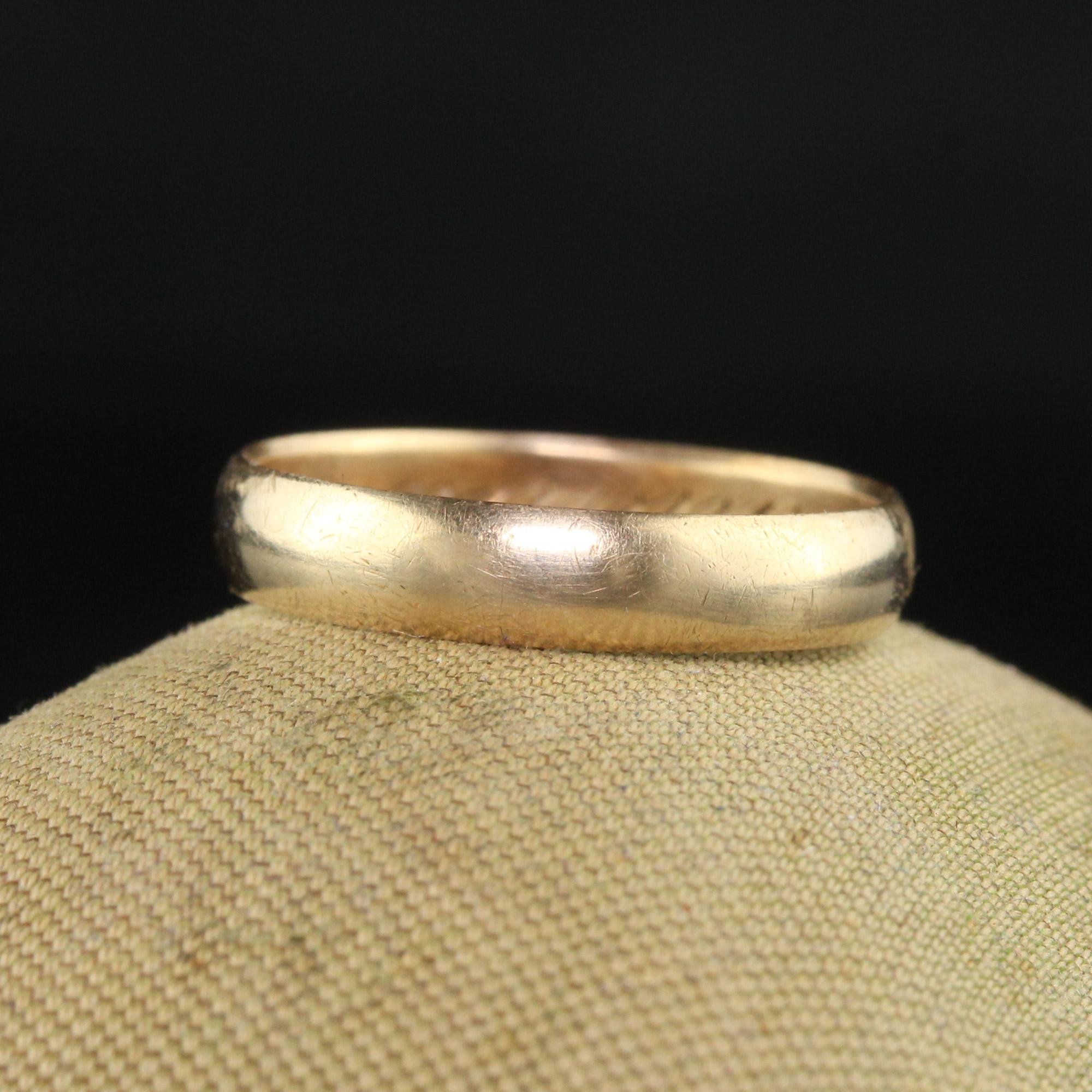 Beautiful Antique Art Deco 14K Yellow Gold Classic Plain Wedding Band - Size 4 1/4. This classic wedding band is crafted in 14k yellow gold. The ring has a nice patina on it and is engraved 