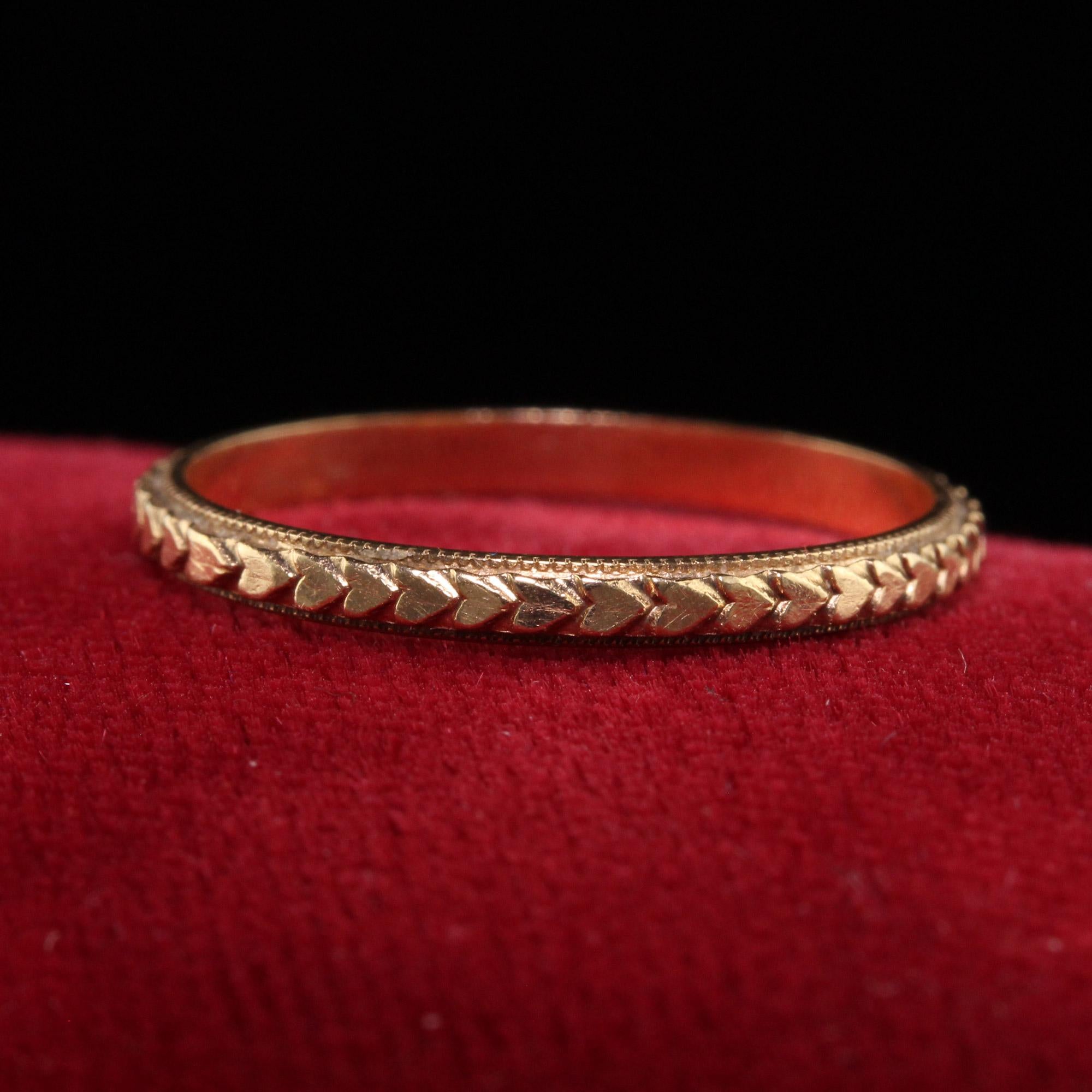 Beautiful Antique Art Deco 14K Yellow Gold Heart Engraved Wedding Band - Size 7. This beautiful wedding band is crafted in 14k yellow gold. The ring is in incredible condition with crisp heart engravings going around the entire ring. The ring sits